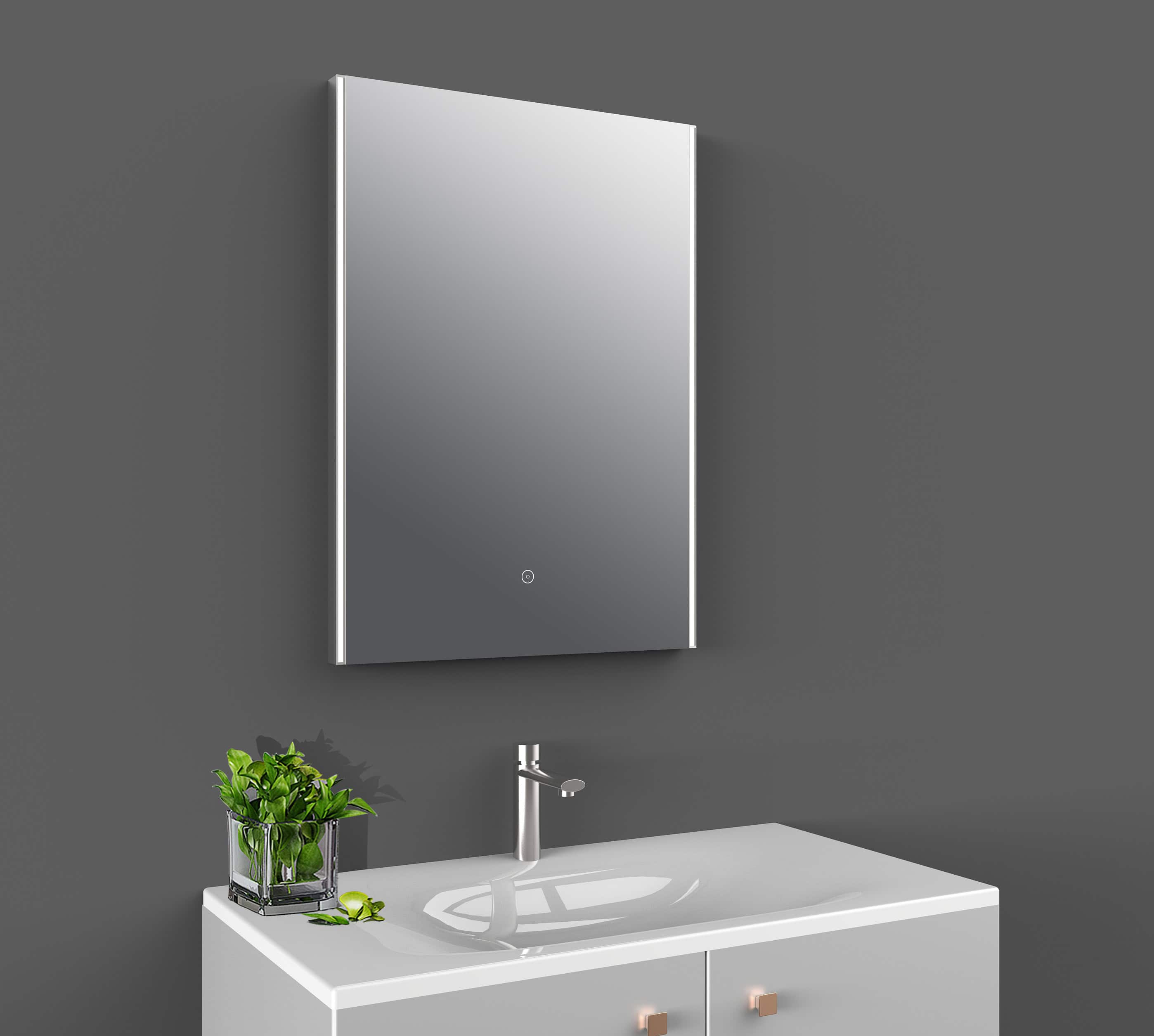 Sleek modern bathroom mirror with LED lighting reflected on a grey bathroom wall.