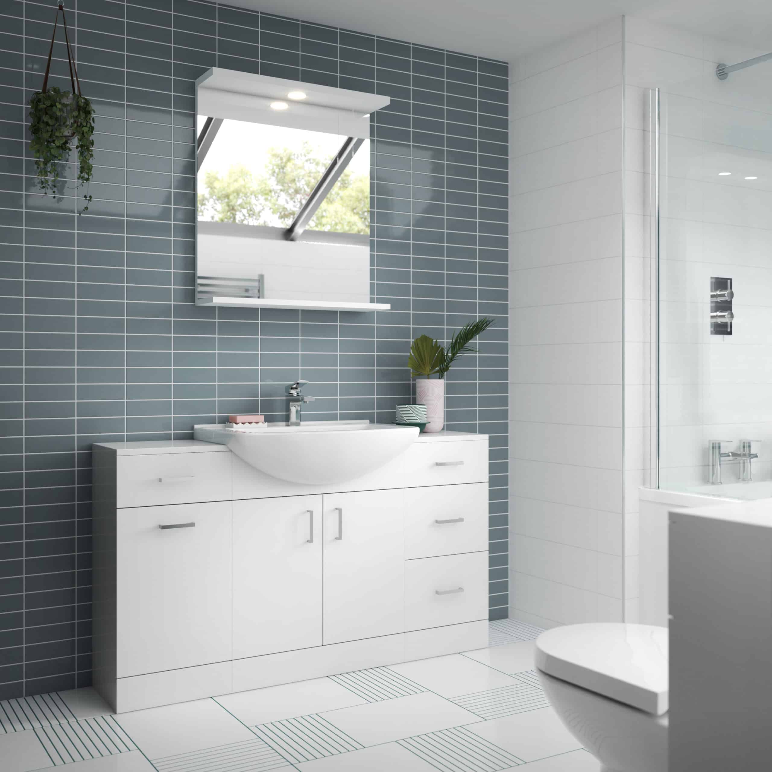 Modern white bathroom vanity with sink, blue tiled accent wall, and large mirror in contemporary bathroom setup.