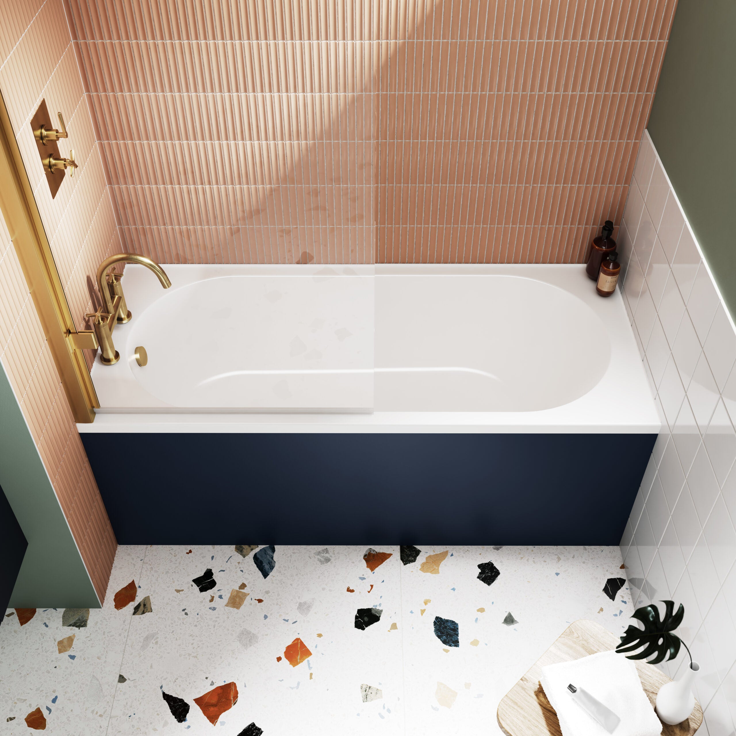 Modern freestanding bathtub with brass fixtures in contemporary bathroom with pink and white tiled walls, terrazzo floor, and minimalist accessories for stylish bathroom decor.