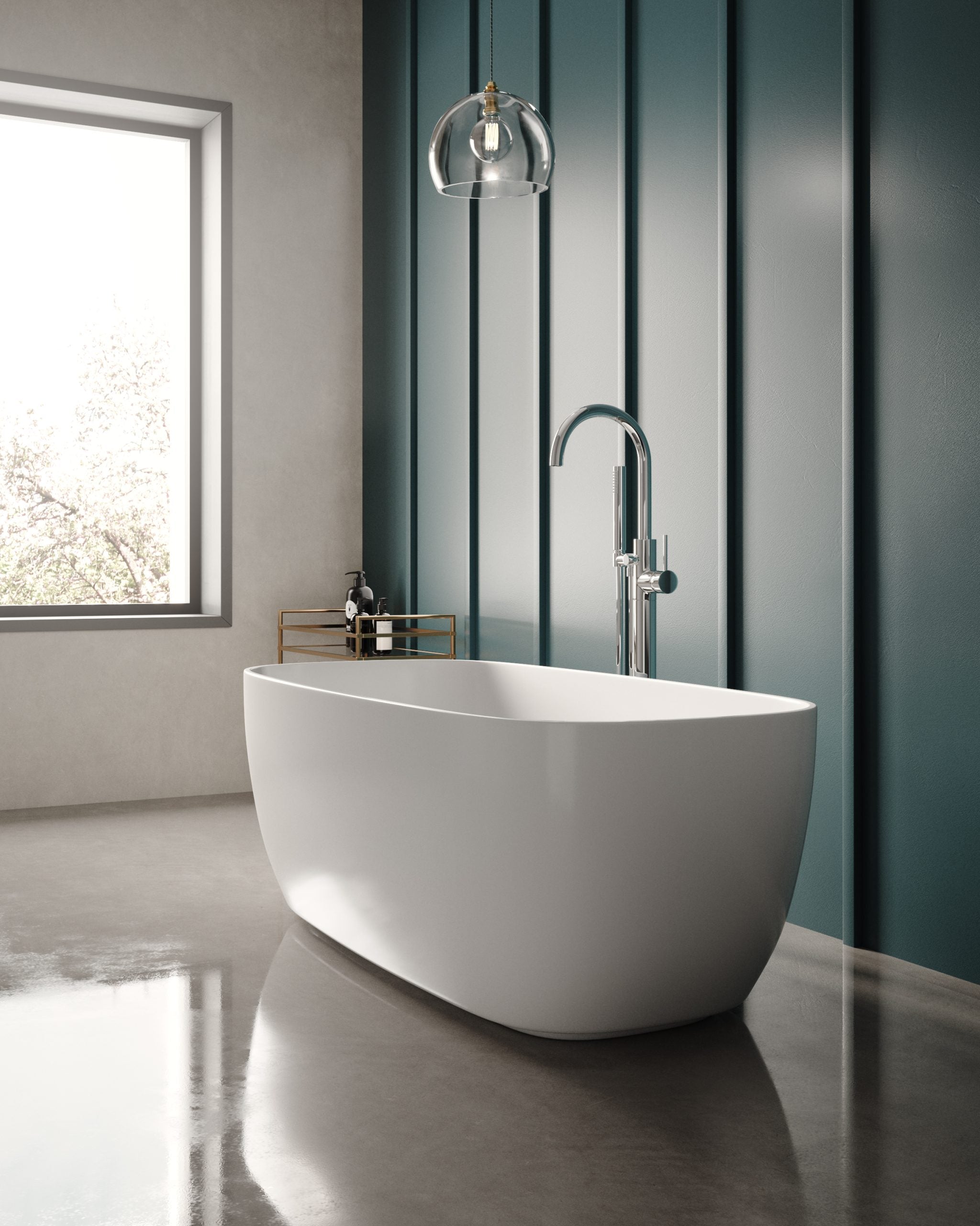 Sleek modern freestanding bathtub in a contemporary bathroom with blue panelled wall, chrome fixtures, and natural light from a large window.