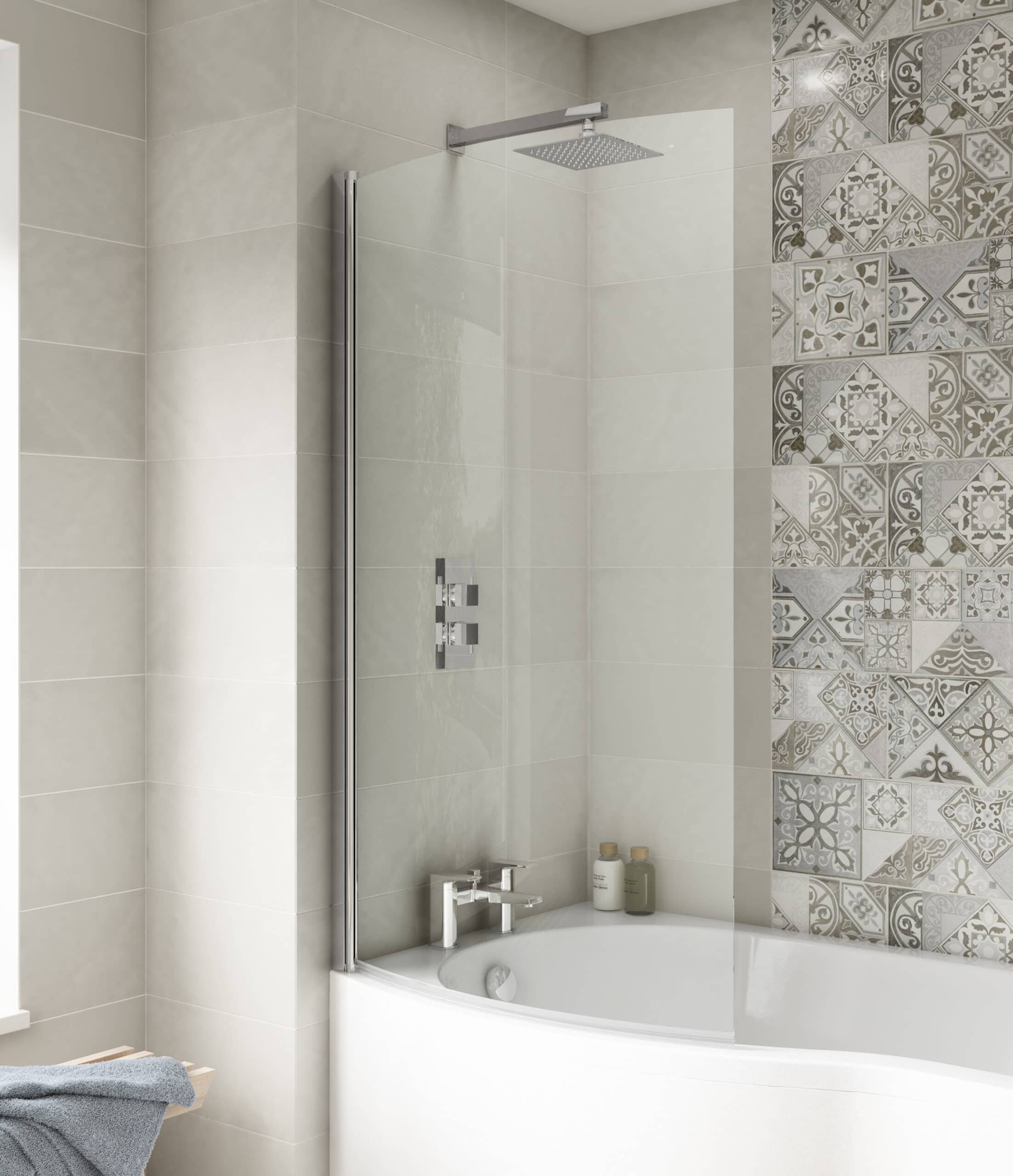 Modern walk-in shower with glass screen and stylish beige and patterned tiles in a contemporary bathroom setting.