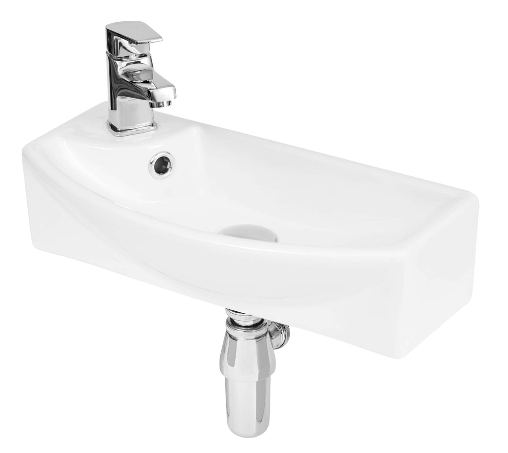 Shiny white bathroom sink with chrome tap and concealed plumbing, ideal for modern bathroom interiors.