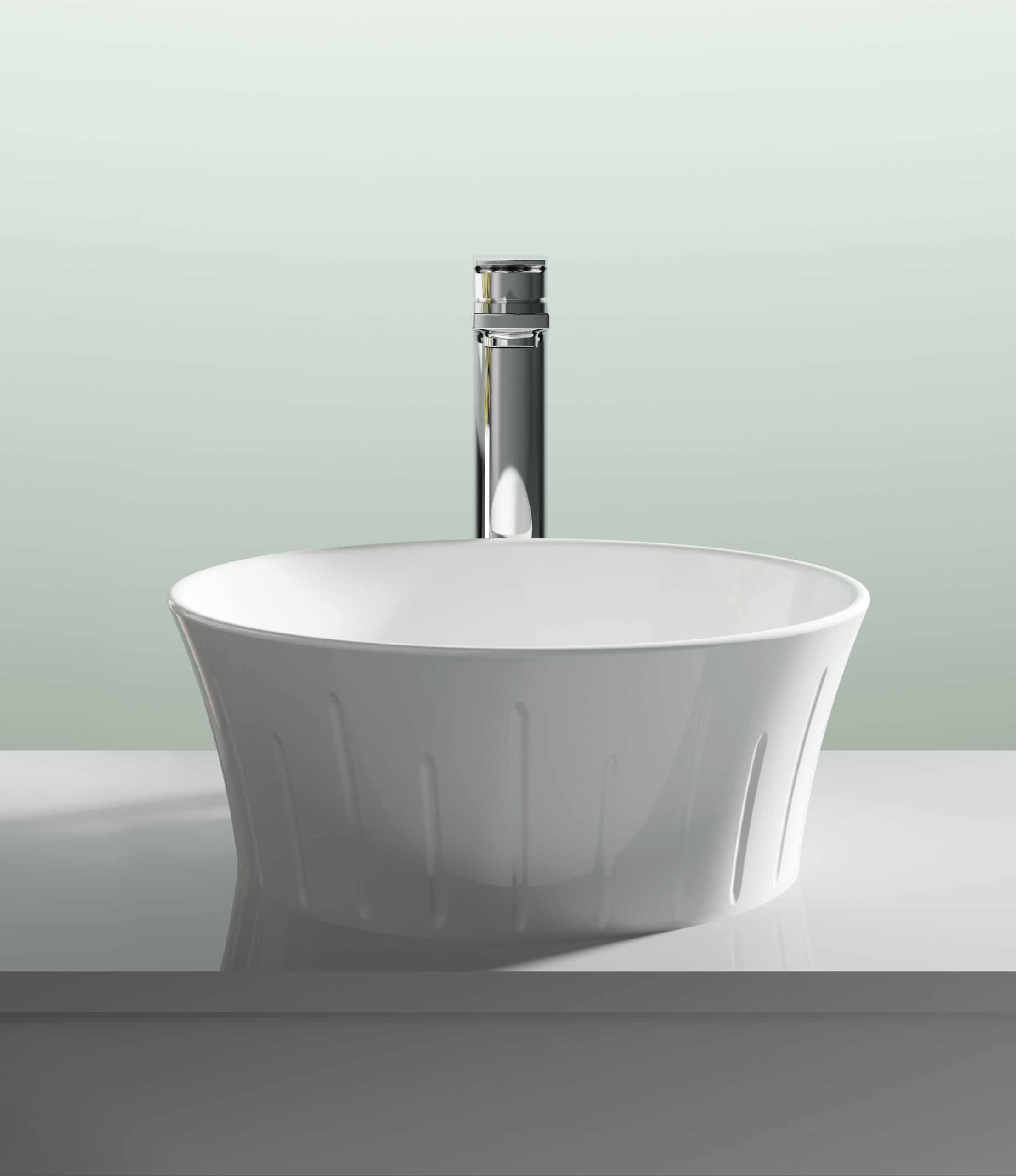 Shiny white ceramic wash basin with modern chrome faucet, ideal for contemporary bathroom decor. Perfect for stylish bathroom sinks and fixtures to enhance your space.