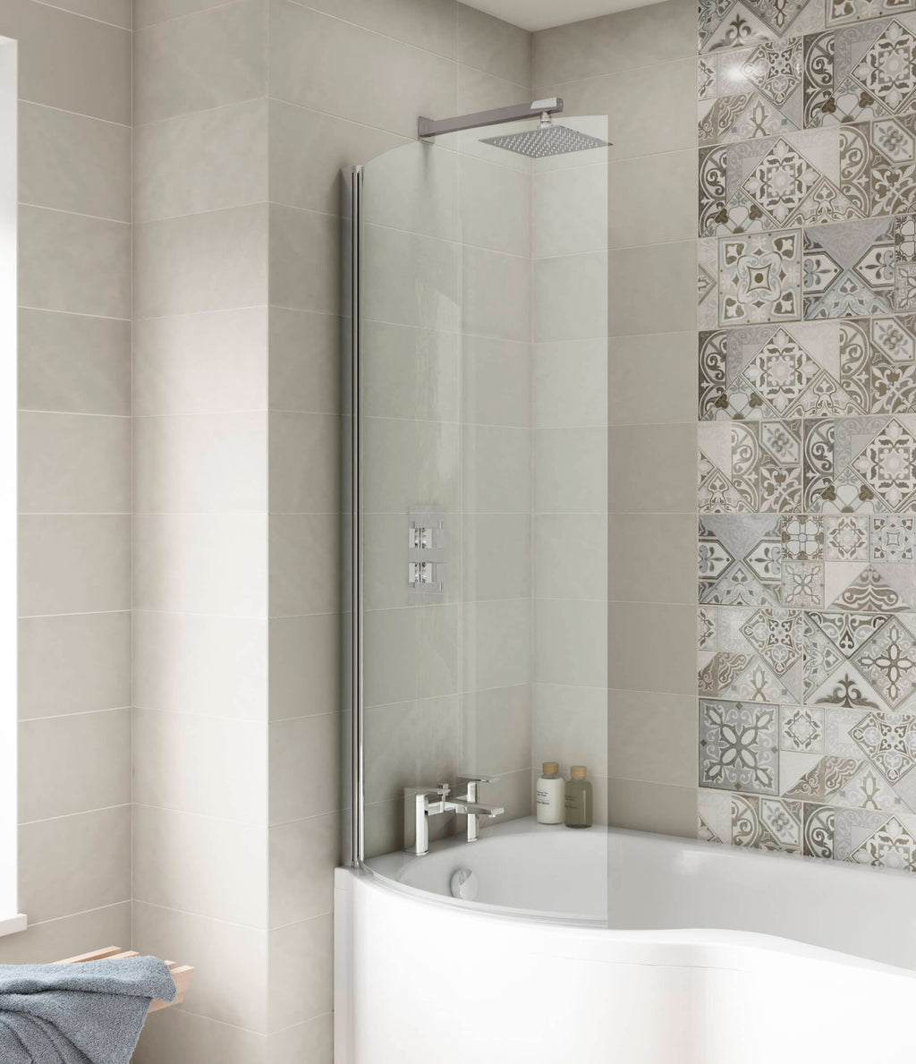Modern bathroom shower with glass screen and beige tiles, decorative patterned wall tiles, and contemporary fixtures designed for relaxation and style.