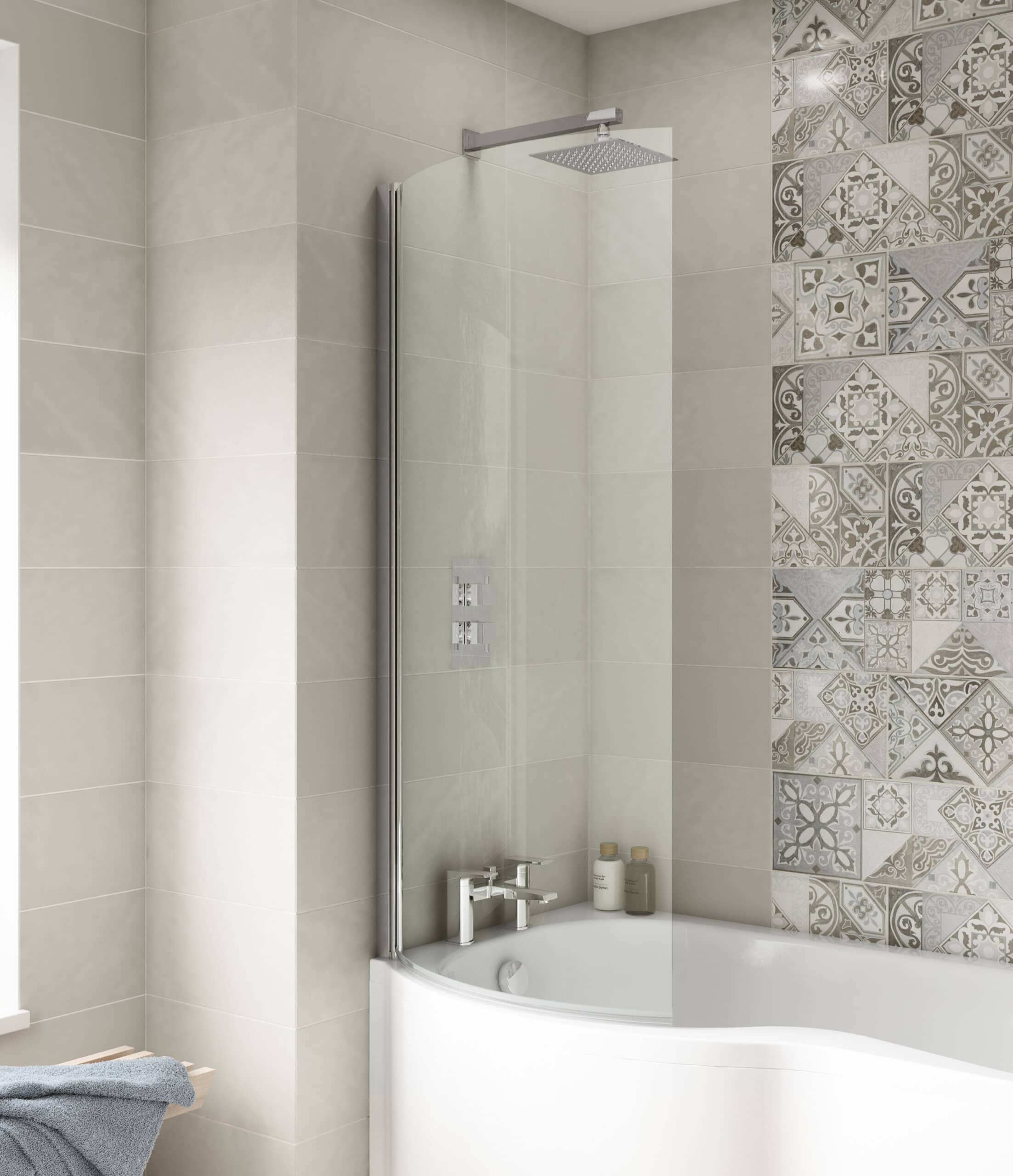 Modern bathroom shower with glass screen and beige tiles, decorative patterned wall tiles, and contemporary fixtures designed for relaxation and style.