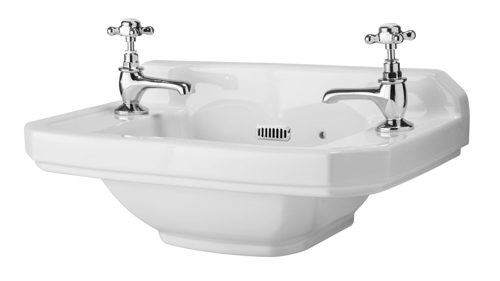 Vintage white ceramic bathroom sink with chrome cross handle taps and built-in overflow, ideal for traditional and classic bathroom designs in UK homes.