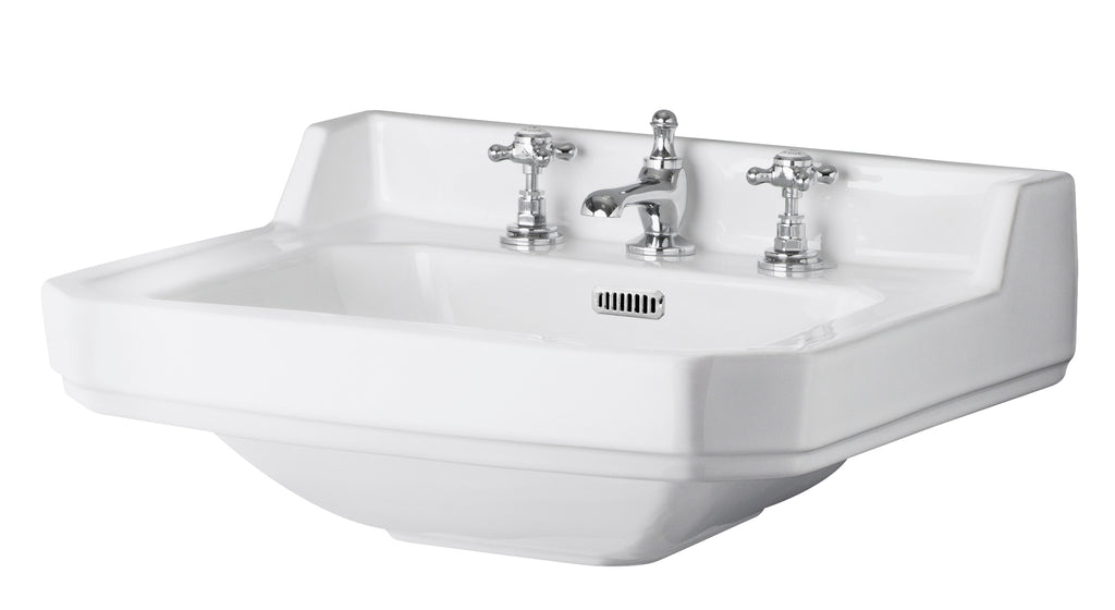 Polished white ceramic wall-mounted bathroom sink with vintage-style chrome taps and an integrated overflow, ideal for classic bathroom designs.
