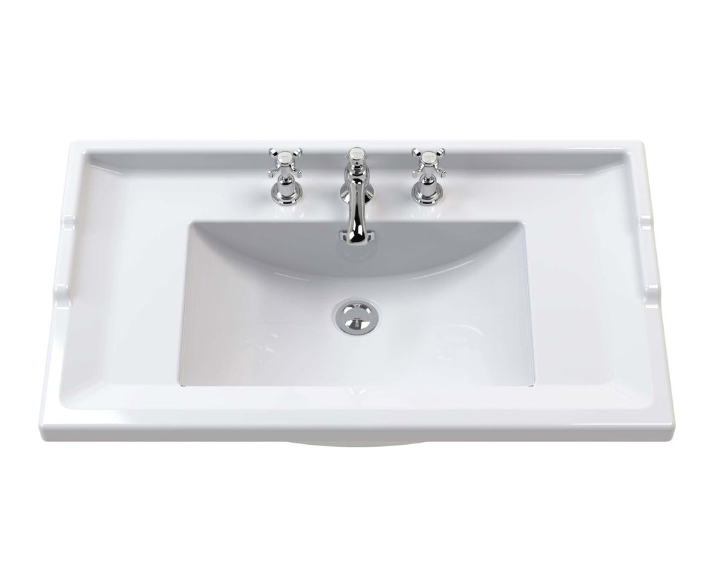 Sleek white bathroom sink with chrome taps, ideal for modern bathroom renovations and installations. Perfect for upgrading your bathroom with stylish and functional fixtures.