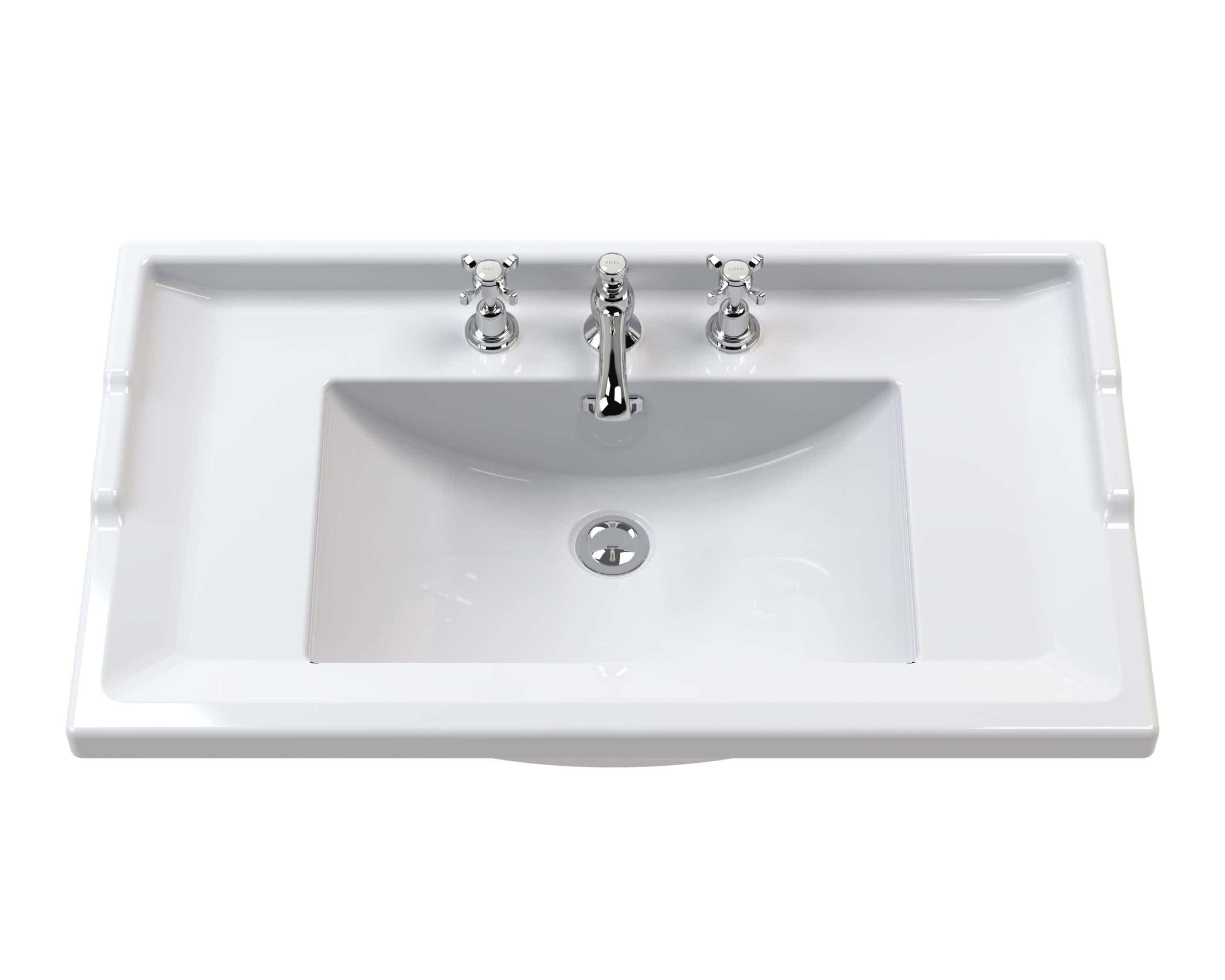 Sleek white bathroom sink with chrome taps, ideal for modern bathroom renovations and installations. Perfect for upgrading your bathroom with stylish and functional fixtures.