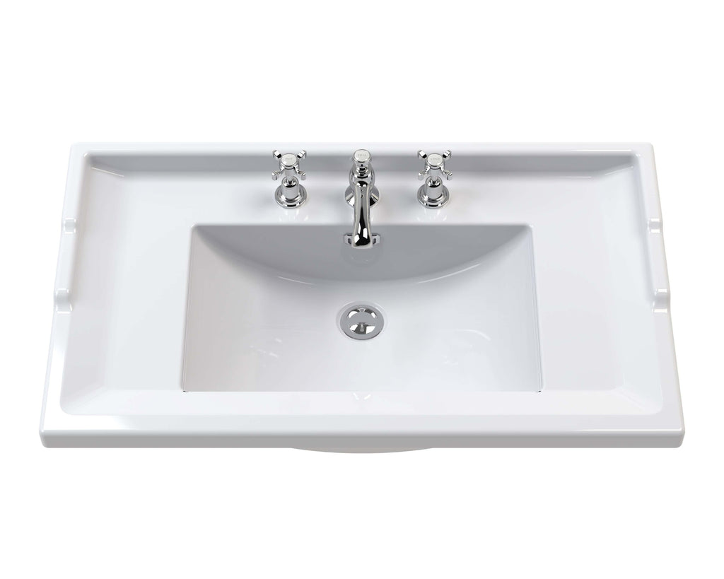 Sleek white bathroom sink with chrome taps and overflow drain, perfect for modern bathroom renovation and styling with quality fixtures.