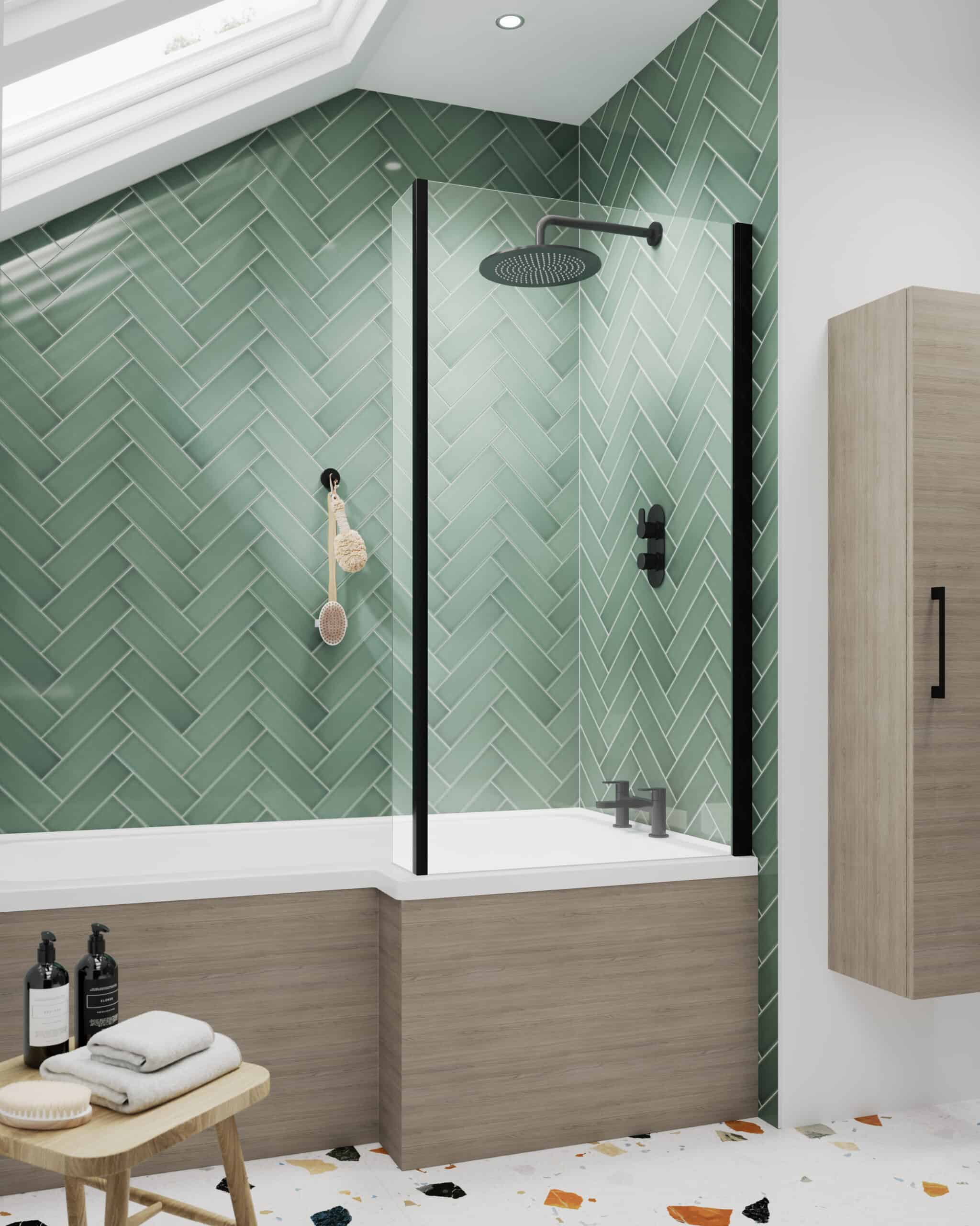 Modern green herringbone tiled bathroom shower with matte black fixtures, minimalist wooden storage, and natural lighting, creating a sleek and contemporary bathroom design.