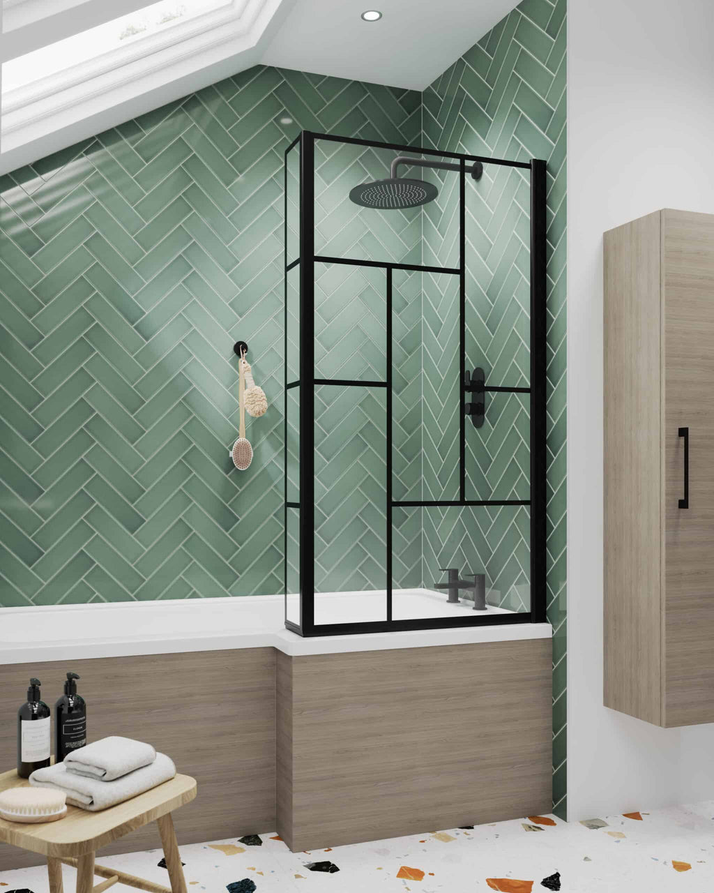Elegant black-framed glass shower enclosure with rain showerhead in a modern bathroom featuring green herringbone tiles and wood accents for a stylish shower space.