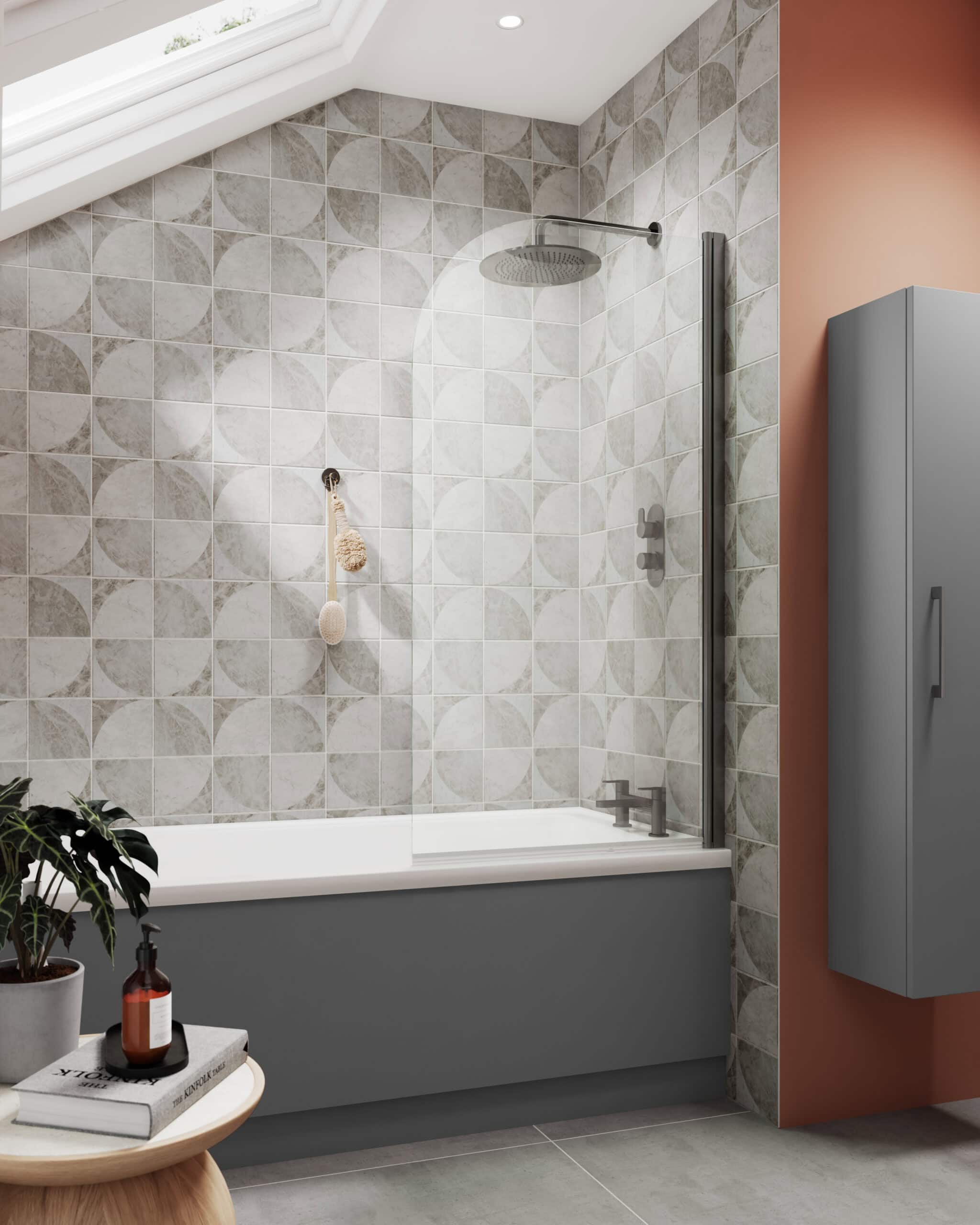 Modern grey bathtub with glass shower screen in a stylish bathroom featuring geometric tile design and natural light from skylight. Perfect for contemporary bathroom renovation ideas.