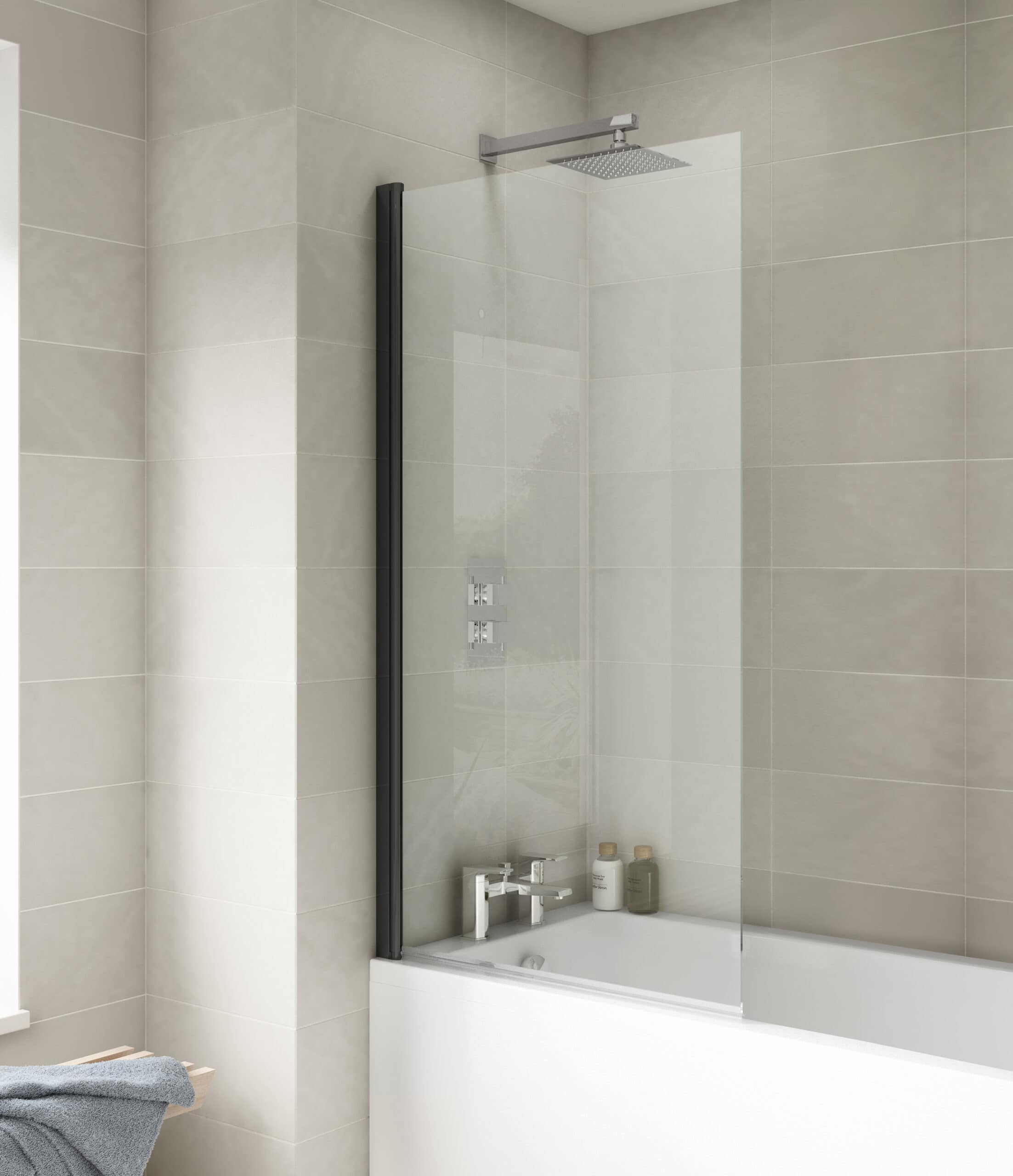 Stylish bathtub with glass shower screen in modern neutral-toned bathroom featuring sleek fixtures and minimalist design. Perfect for contemporary bathroom renovation and luxury bathroom design.