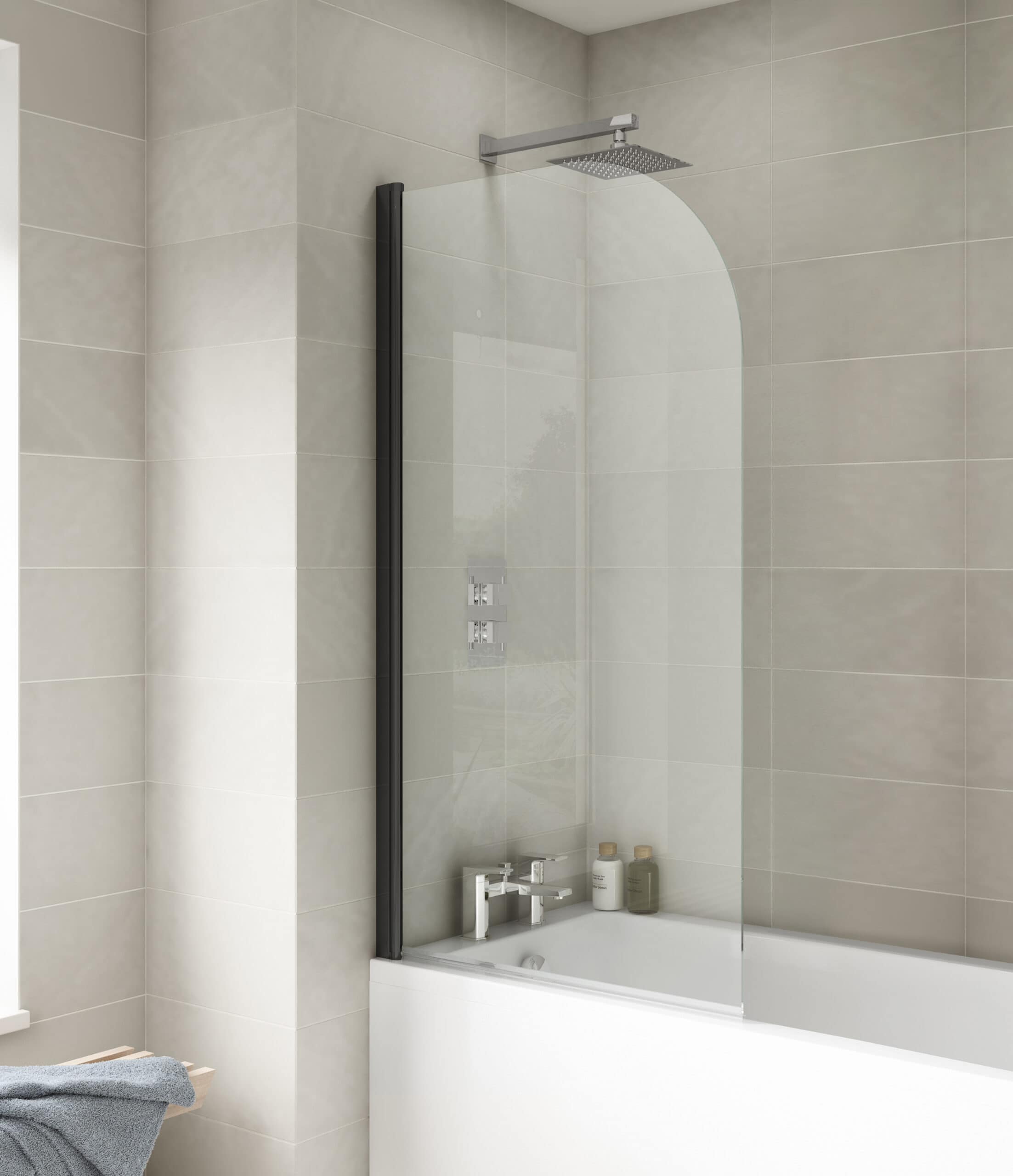 Modern glass shower screen with sleek black frame in contemporary bathroom design.