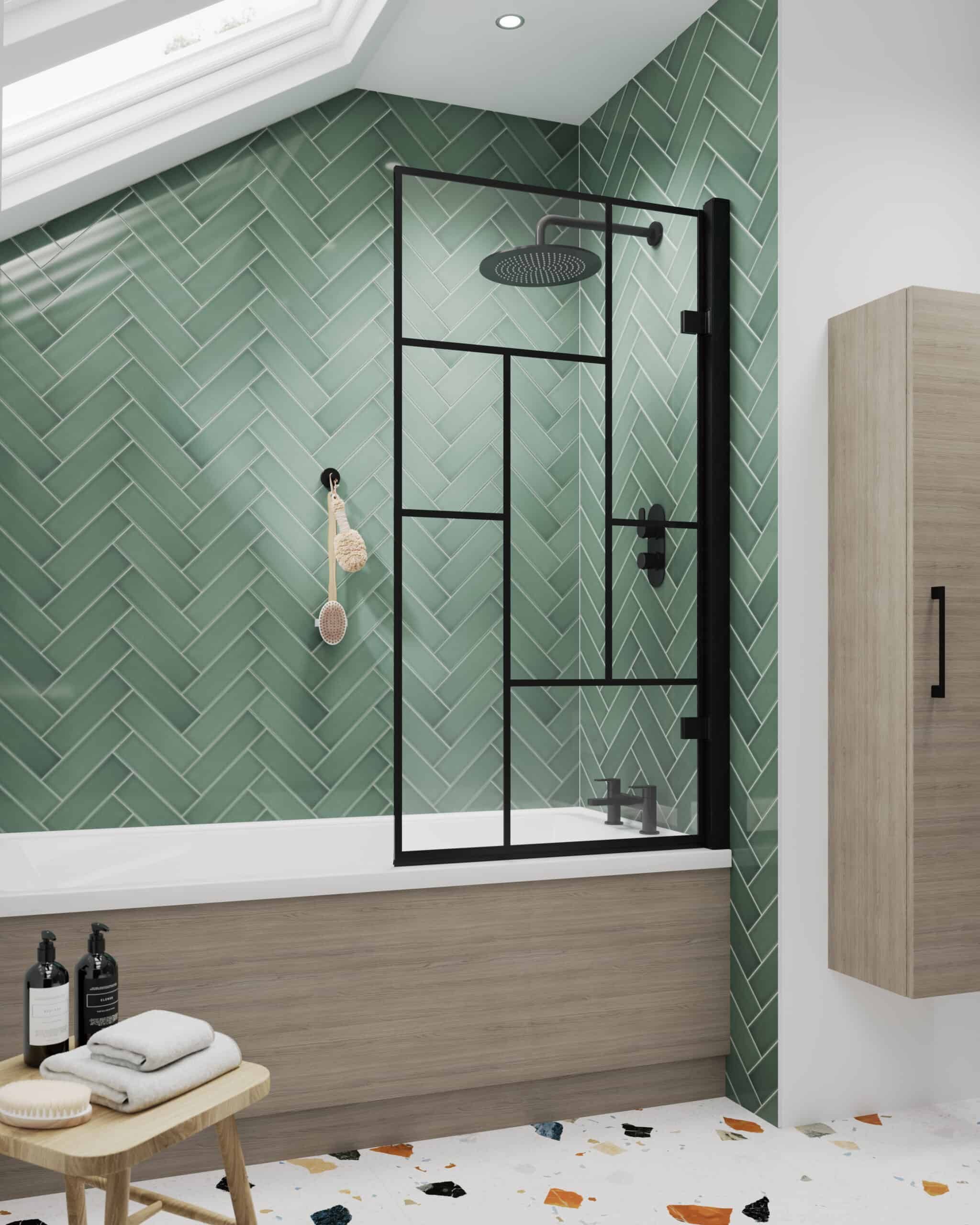 Contemporary walk-in shower with black-framed glass, green chevron tiles, and natural-light skylight in a modern bathroom.