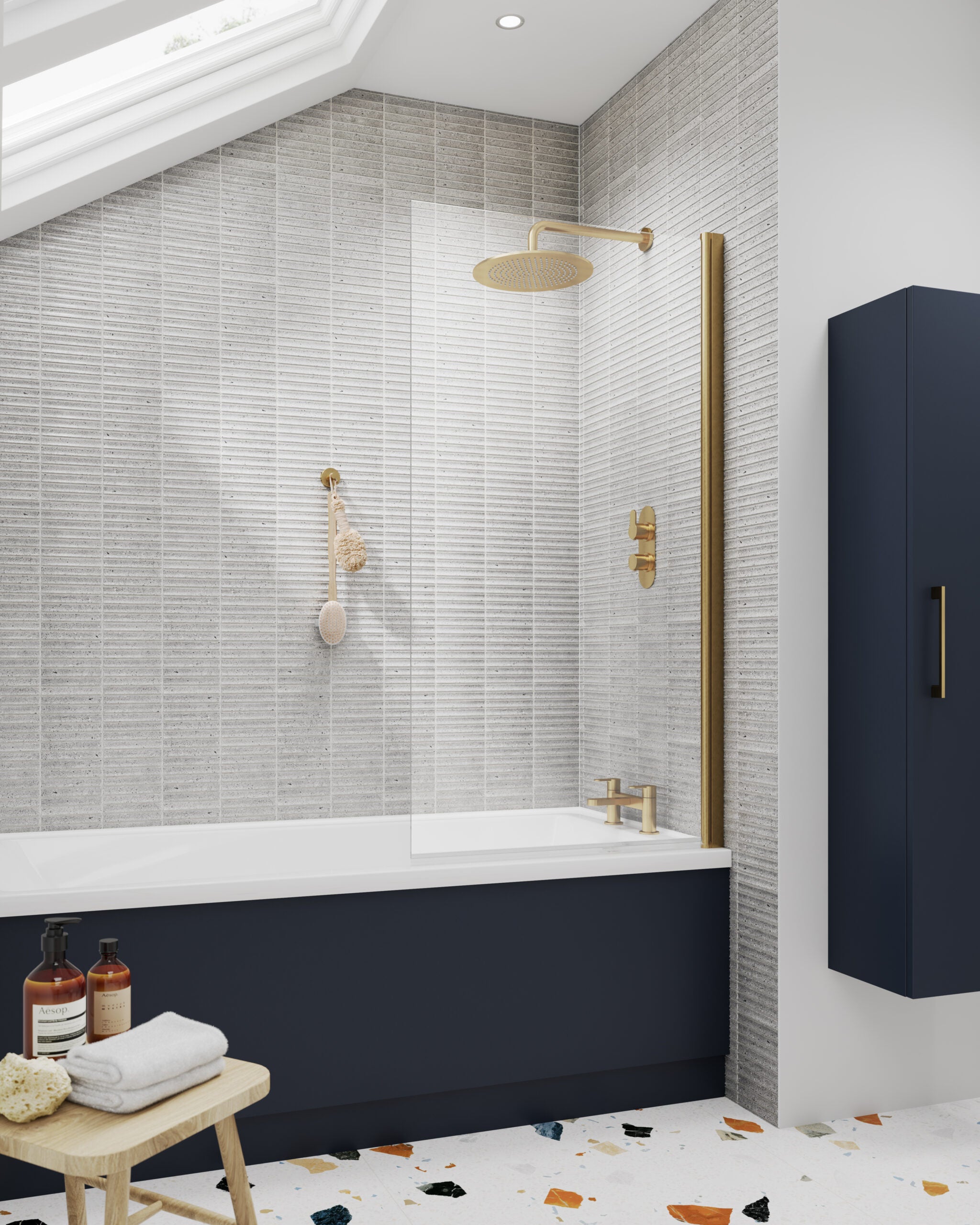 Shower room with a modern navy blue bath, gold fixtures, and textured white tiled walls. Features a rainfall shower head and a glass screen, creating a contemporary and luxurious bathroom design.