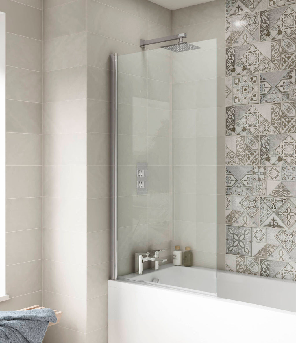 Sleek modern bathroom shower with glass screen, beige wall tiles, and decorative patterned tiles on the wall, creating a stylish and functional bathroom space.