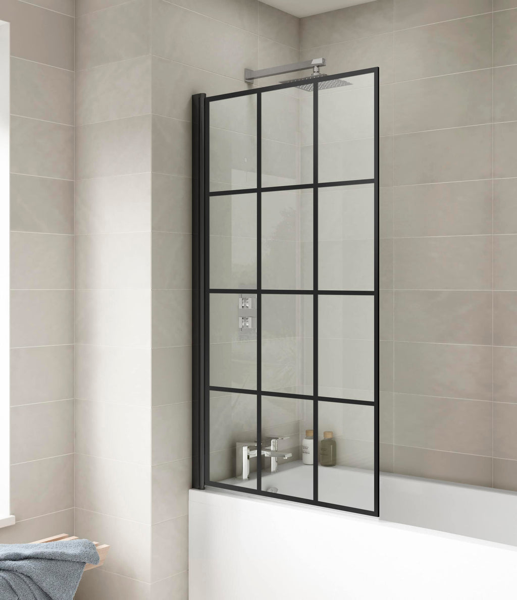 Modern black-framed glass bathroom screen separating shower area in contemporary bathroom with beige tiles.