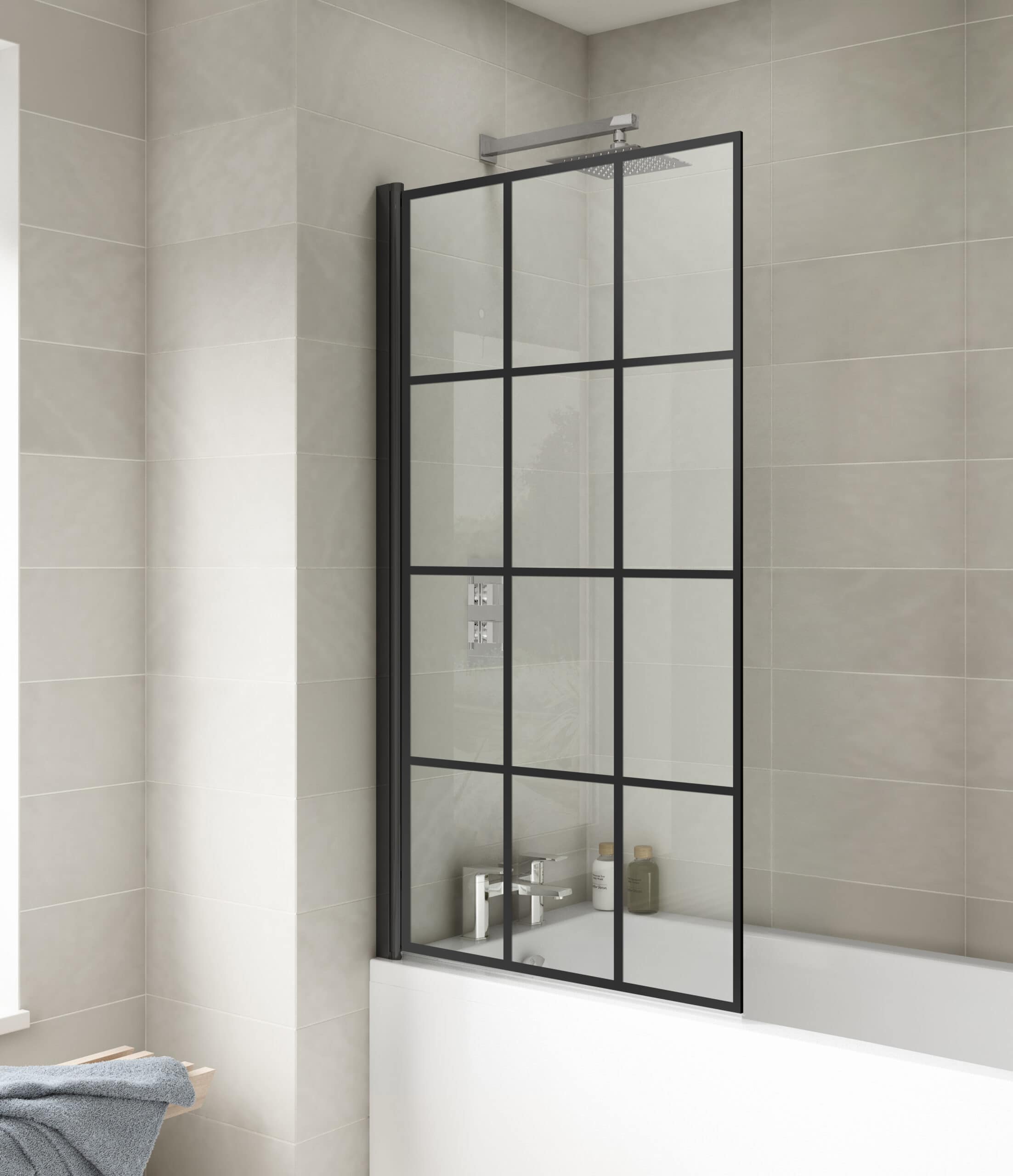 Modern black-framed glass bathroom screen separating shower area in contemporary bathroom with beige tiles.