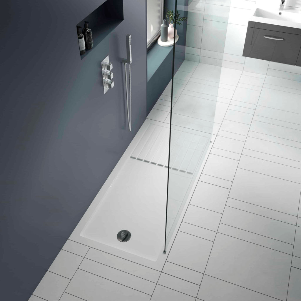 Modern walk-in shower with a glass screen, stylish grey wall, and white tiled floor, featuring sleek fixtures and a minimalist design for contemporary bathrooms.