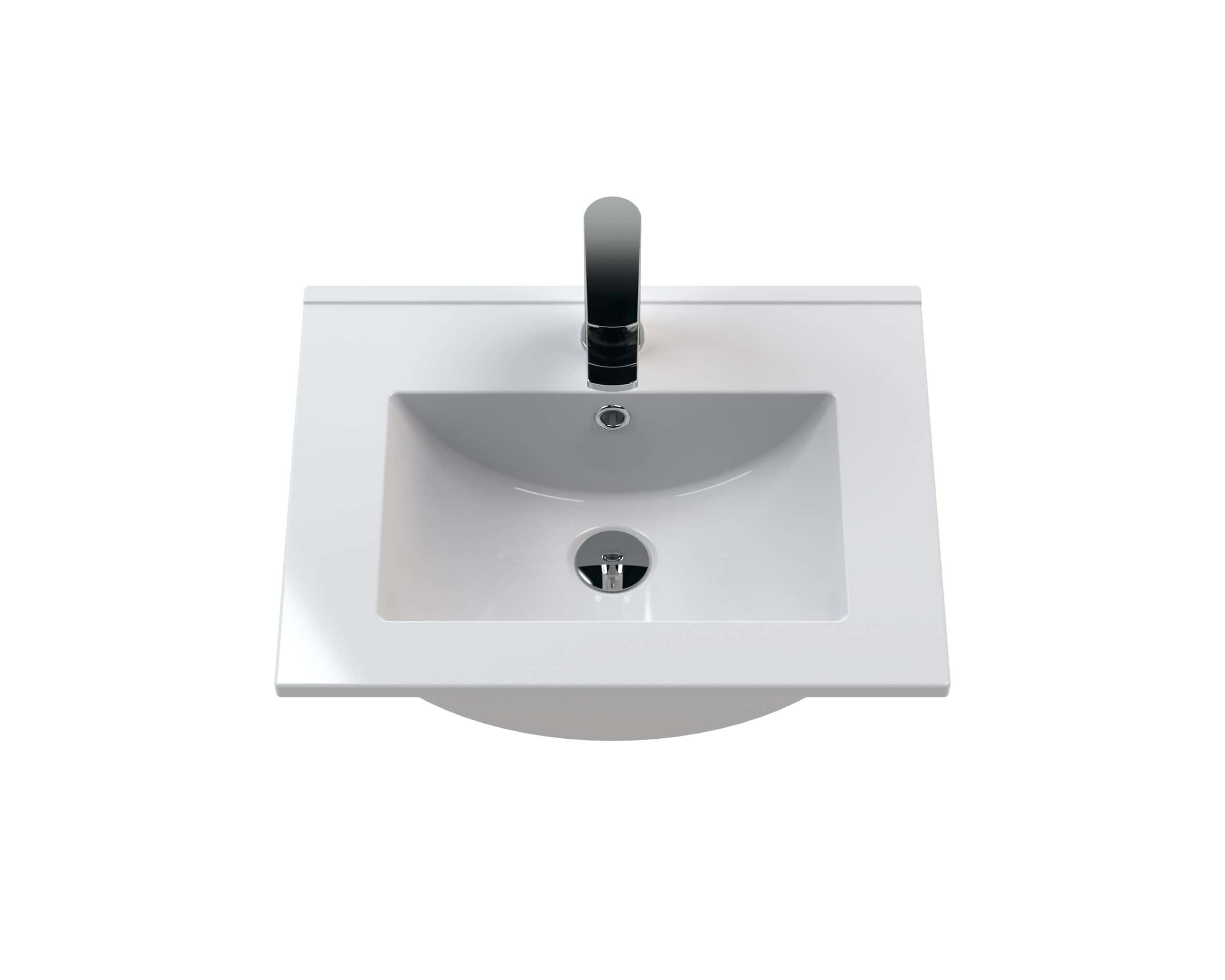 Sleek white bathroom sink with modern black tap, ideal for stylish and functional bathroom designs, featuring a square basin and chrome waste for easy maintenance.