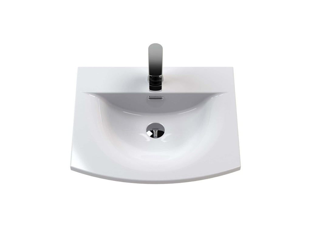 Modern white bathroom sink with sleek chrome tap and integrated overflow, ideal for contemporary bathroom designs.