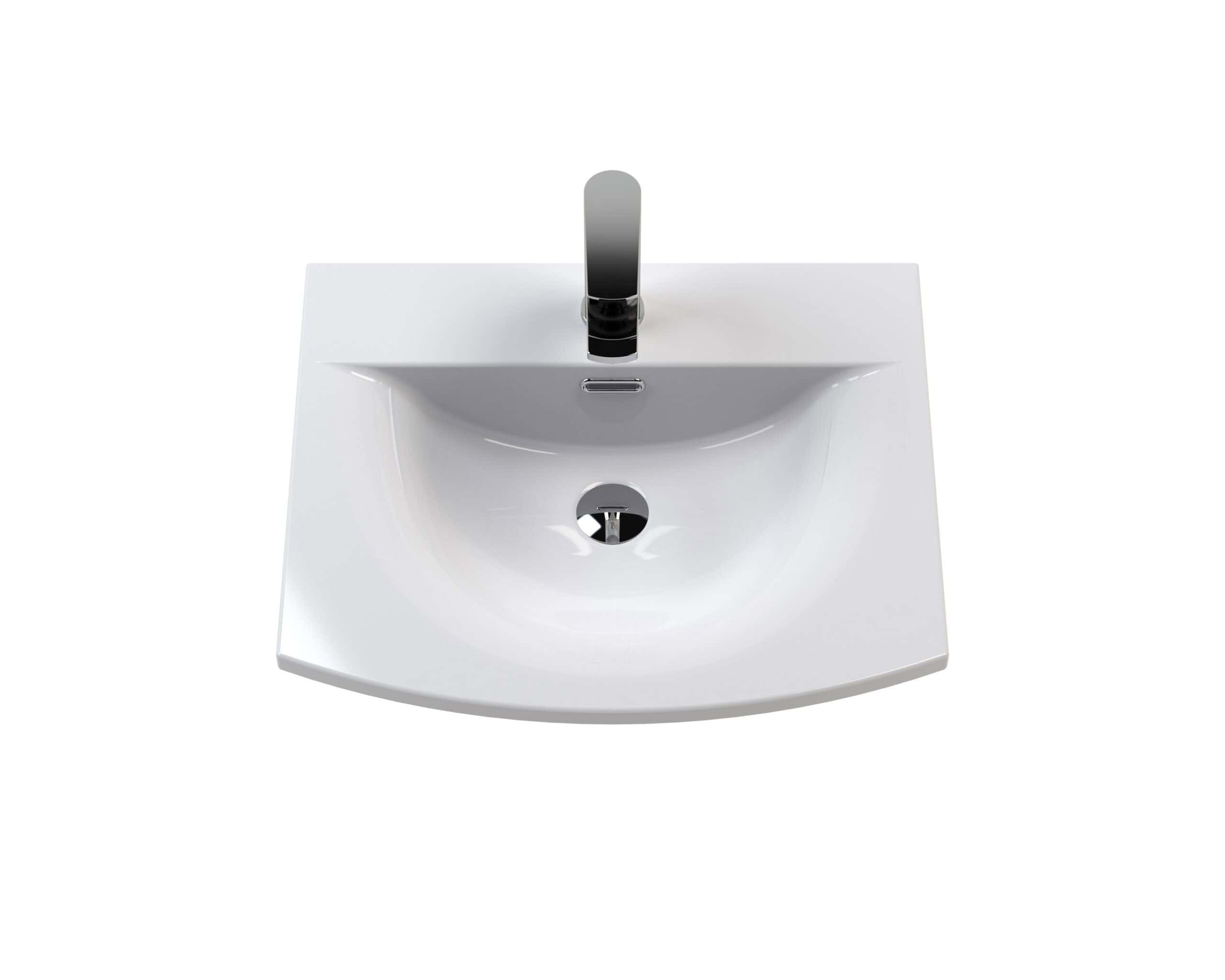 Modern white bathroom sink with sleek chrome tap and integrated overflow, ideal for contemporary bathroom designs.
