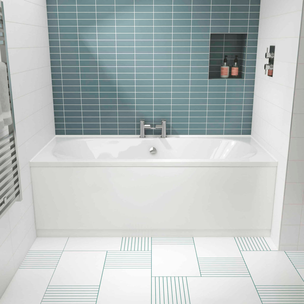 Sleek modern bathtub with blue subway tile wall and built-in shower niche in contemporary bathroom design.