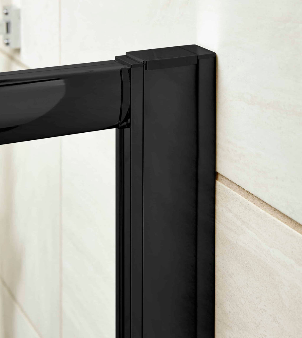 Sleek black bathroom door frame with modern hinges on light beige tiled wall.