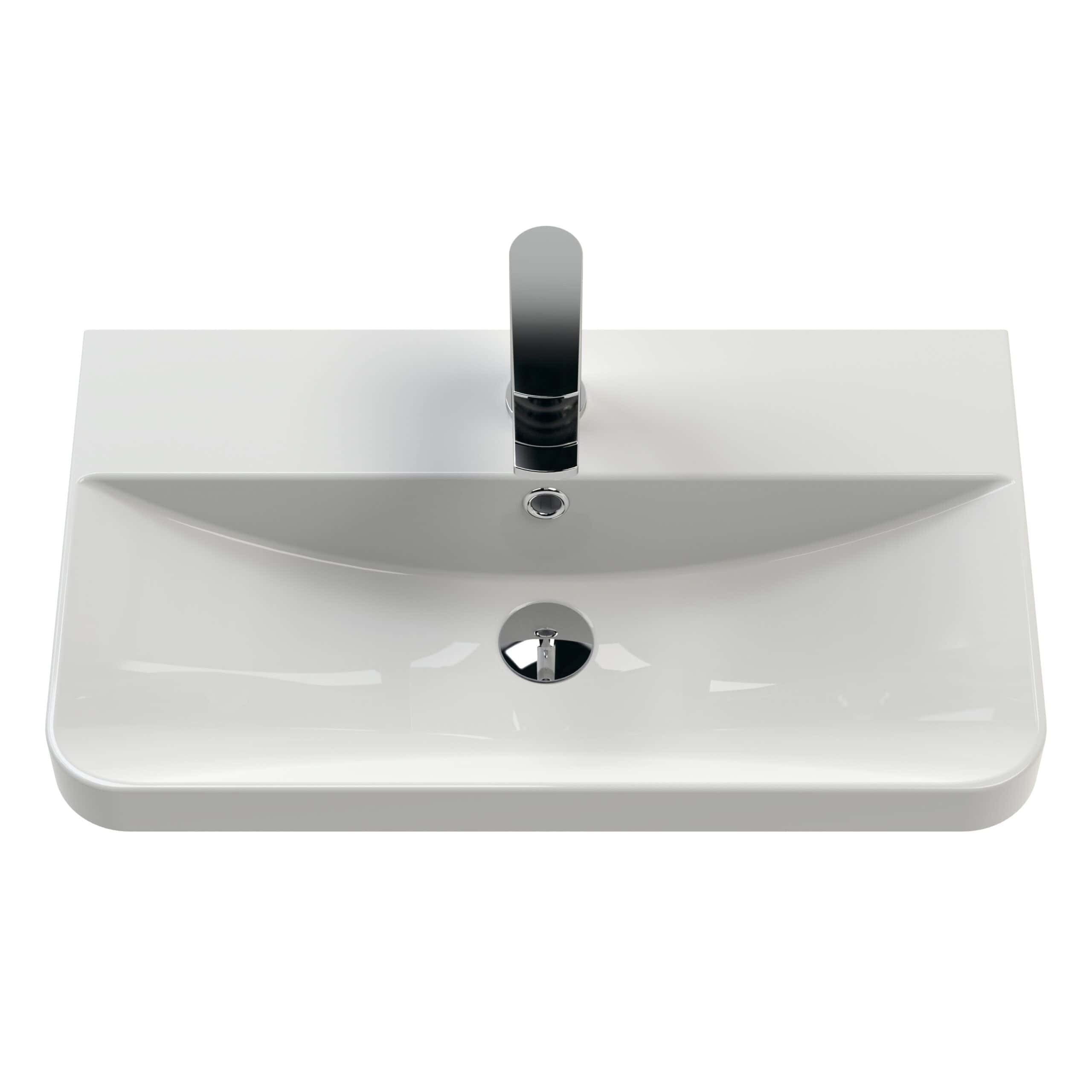 Sleek white bathroom sink with chrome tap and overflow, modern design ideal for stylish bathroom renovations or upgrades. Perfect for contemporary bathroom spaces seeking elegance and functionality.