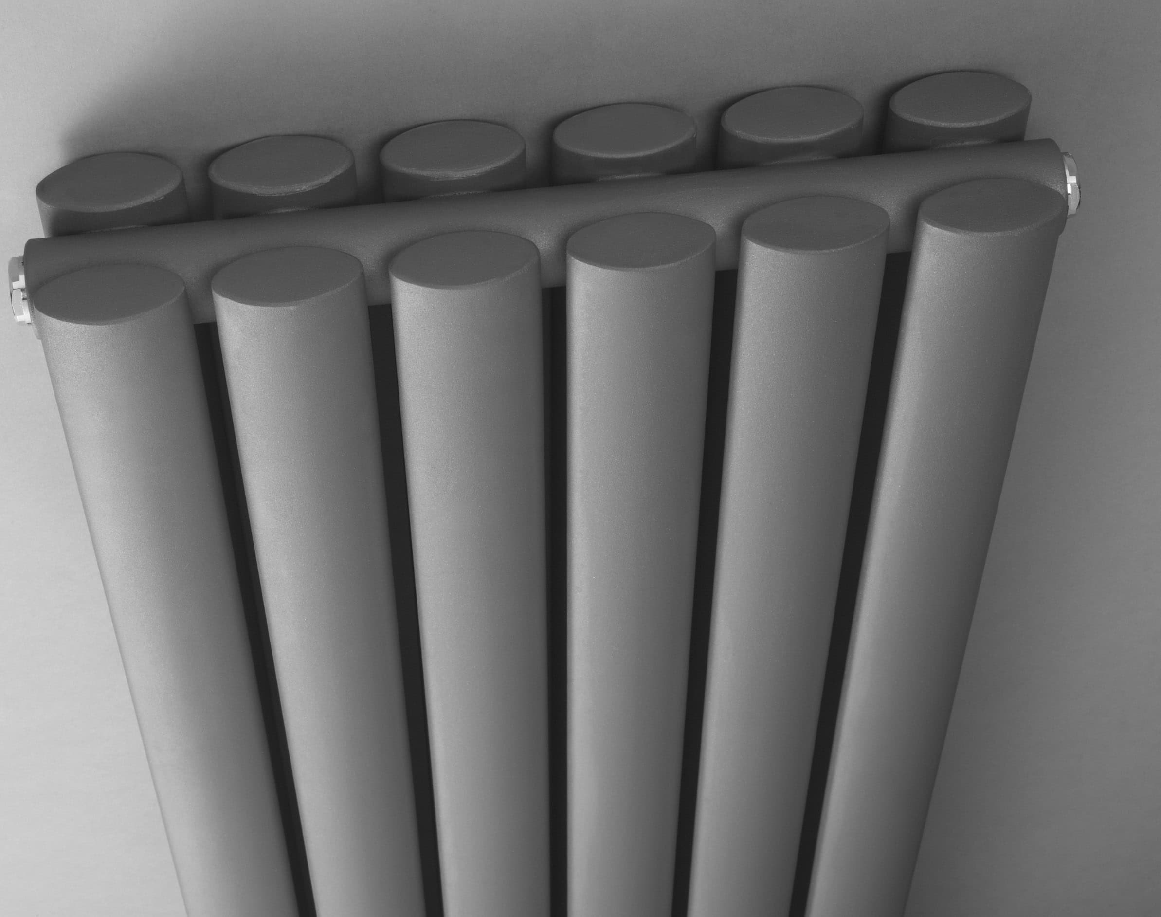 Sleek modern radiator design in shades of grey, ideal for contemporary bathroom settings, featuring a vertical panel style for efficient heat distribution.