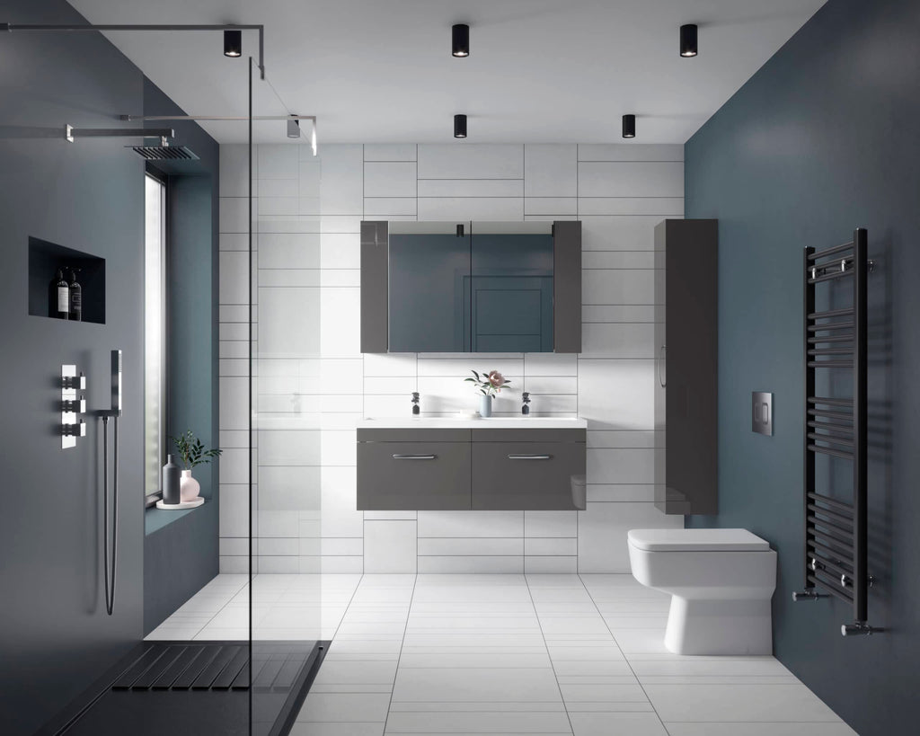 Modern grey and white bathroom with shower, wash basin, mirror cabinet, toilet, and heated towel rail, featuring sleek contemporary design and minimalistic style.