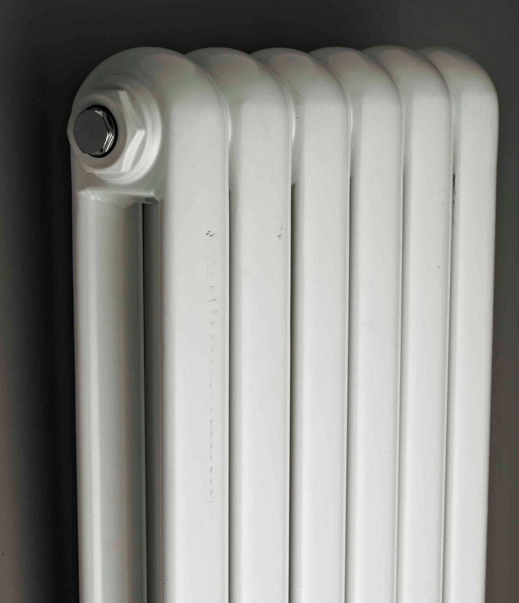 Radiator for bathroom heating, white panel radiator for bathrooms, wall-mounted towel heater, modern design, efficient heat emission, bubly.co.uk bathroom radiator solutions.