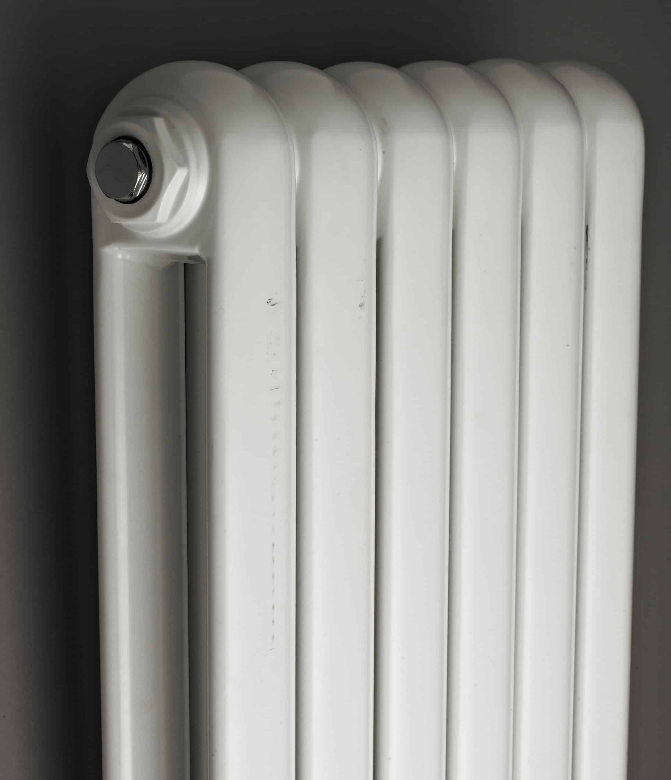Radiator for bathroom heating, white panel radiator for bathrooms, wall-mounted towel heater, modern design, efficient heat emission, bubly.co.uk bathroom radiator solutions.
