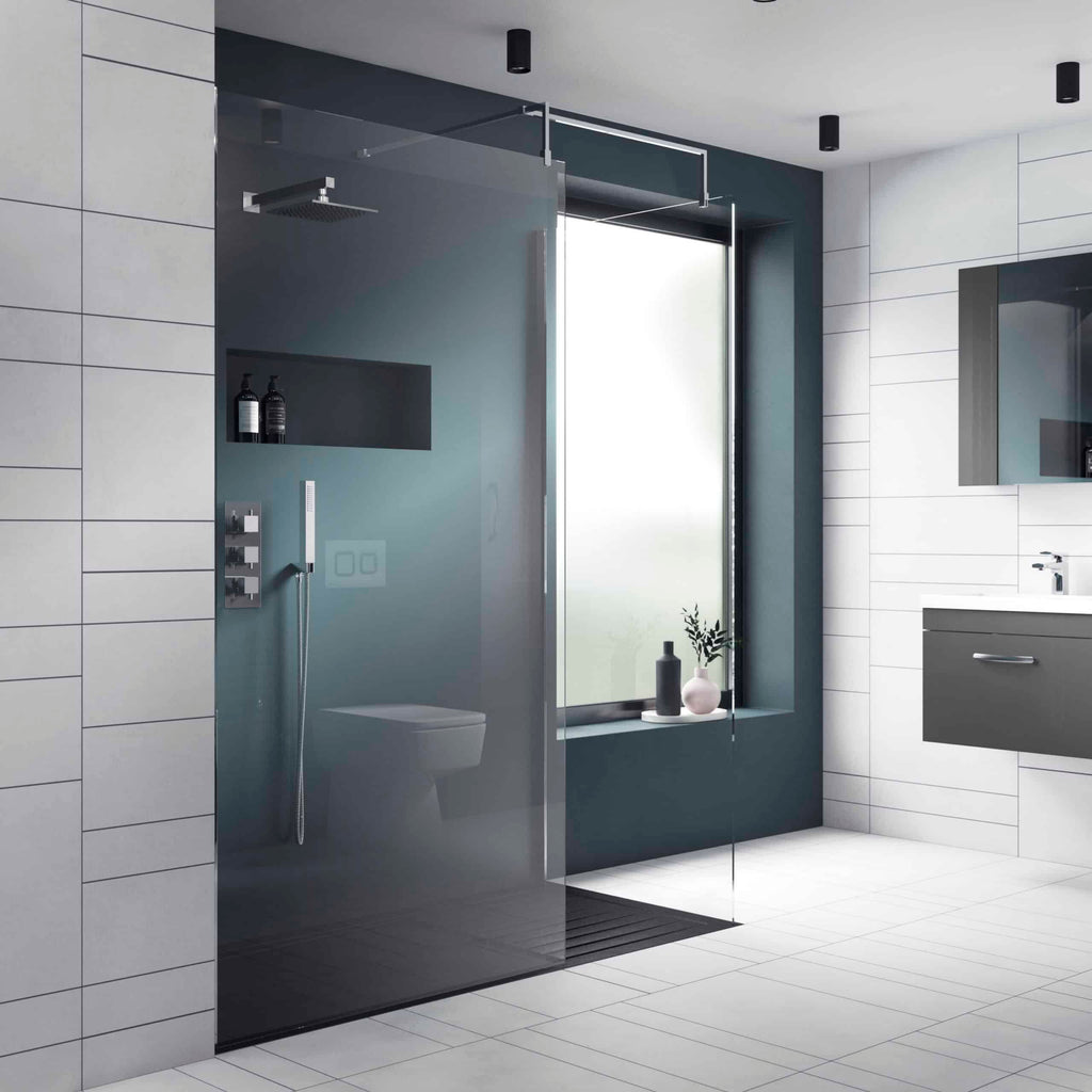 Modern minimalist bathroom with walk-in shower, frosted glass door, large window, and sleek grey and white fixtures for a contemporary bathroom design.
