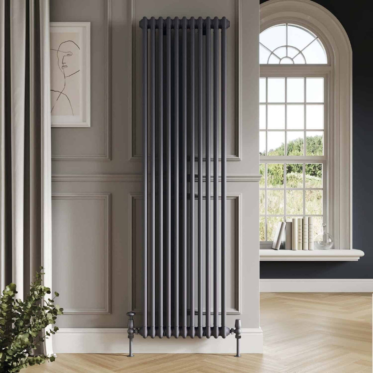 Vertical black cast iron radiator in elegant bathroom with large window and decorative wall paneling, modern central heating radiator design, monochrome interior decor, high-quality home heating solution, Bubly Bathrooms.