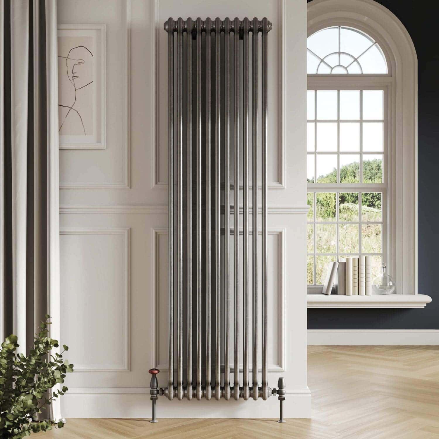 Chrome vertical modern radiator in a stylish bathroom with elegant interior design and large window, perfect for contemporary home heating solutions.