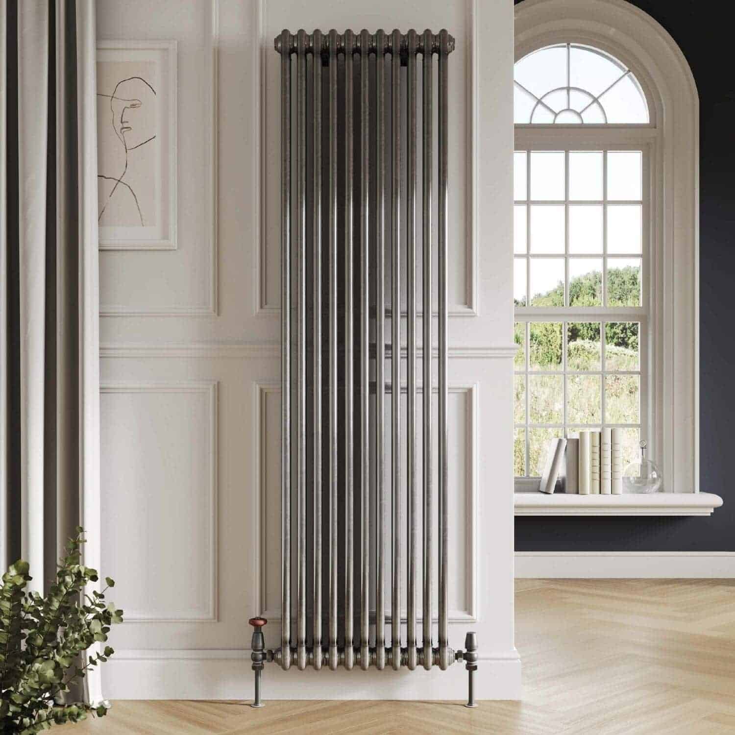 Luxury modern vertical chrome radiator in a stylish bathroom setting with elegant wall paneling and a large window.