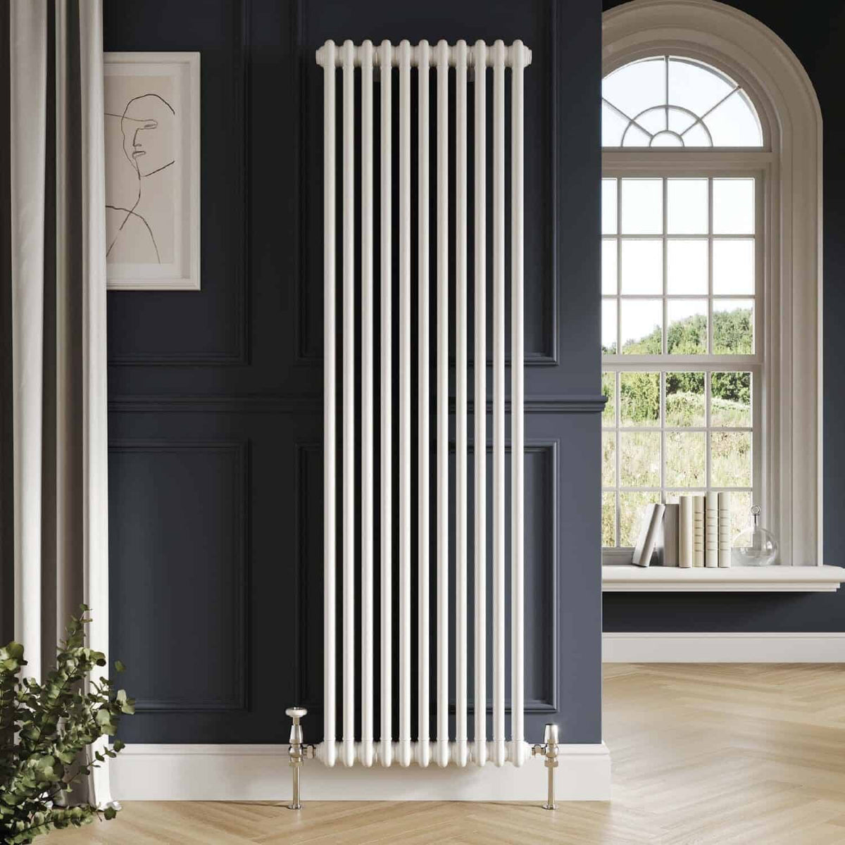 Sleek white vertical radiator mounted on dark navy wall in modern bathroom with large arched window and minimalist decor.