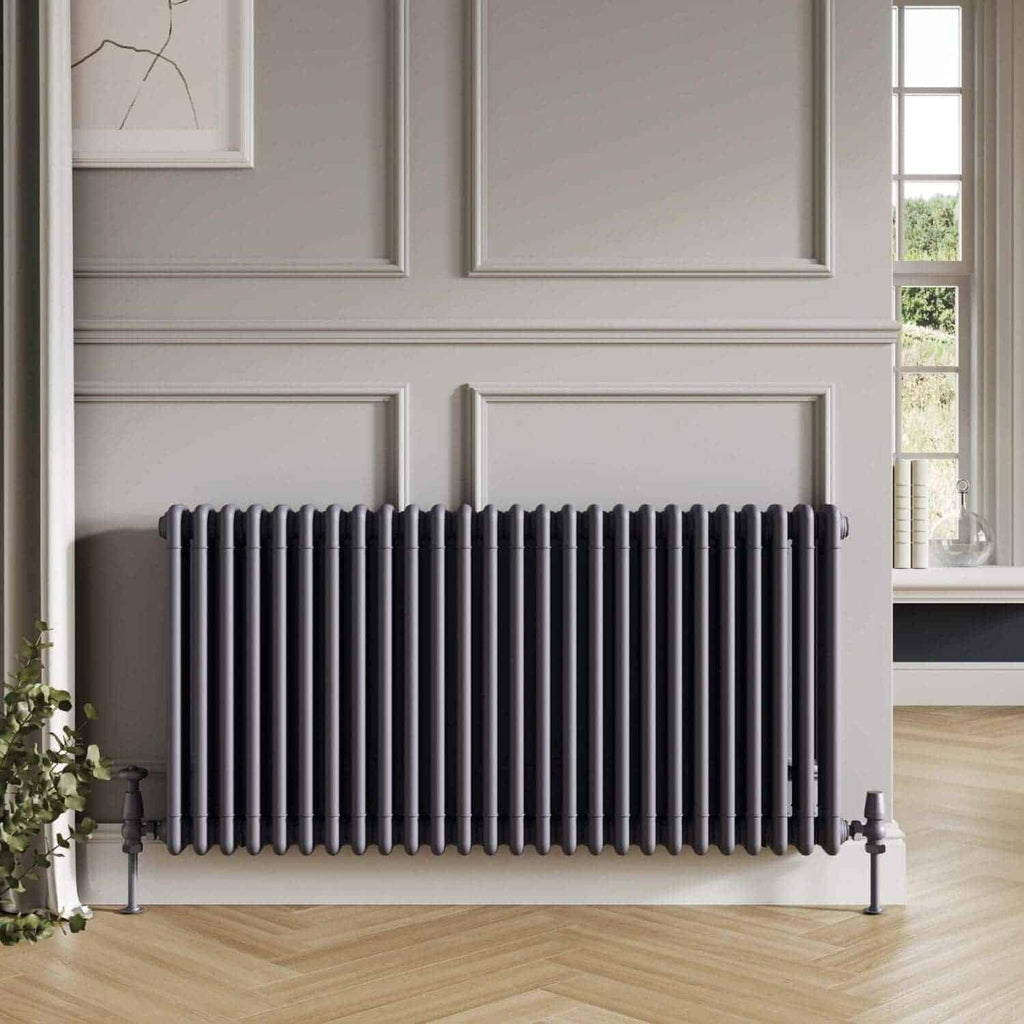 Sleek black radiator in modern bathroom with interior wall paneling and large window, creating a stylish and functional heating solution for contemporary home spaces.