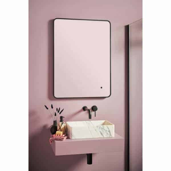 Bubly bathrooms modern minimalist wall-mounted bathroom mirror with LED lighting and marble basin in pink bathroom setting.