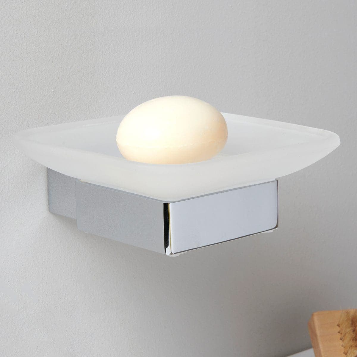 Sleek modern wall-mounted bathroom light fixture with frosted glass shade and illuminated sphere, perfect for contemporary bathroom lighting and enhancing bathroom decor.