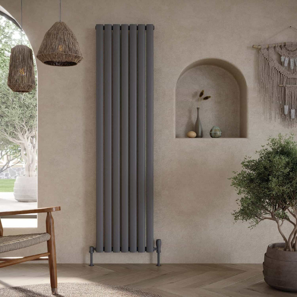 Radiator in modern bathroom, grey vertical heating panel, stylish bathroom decor, warm and functional radiators, cosy bathroom heating solution.