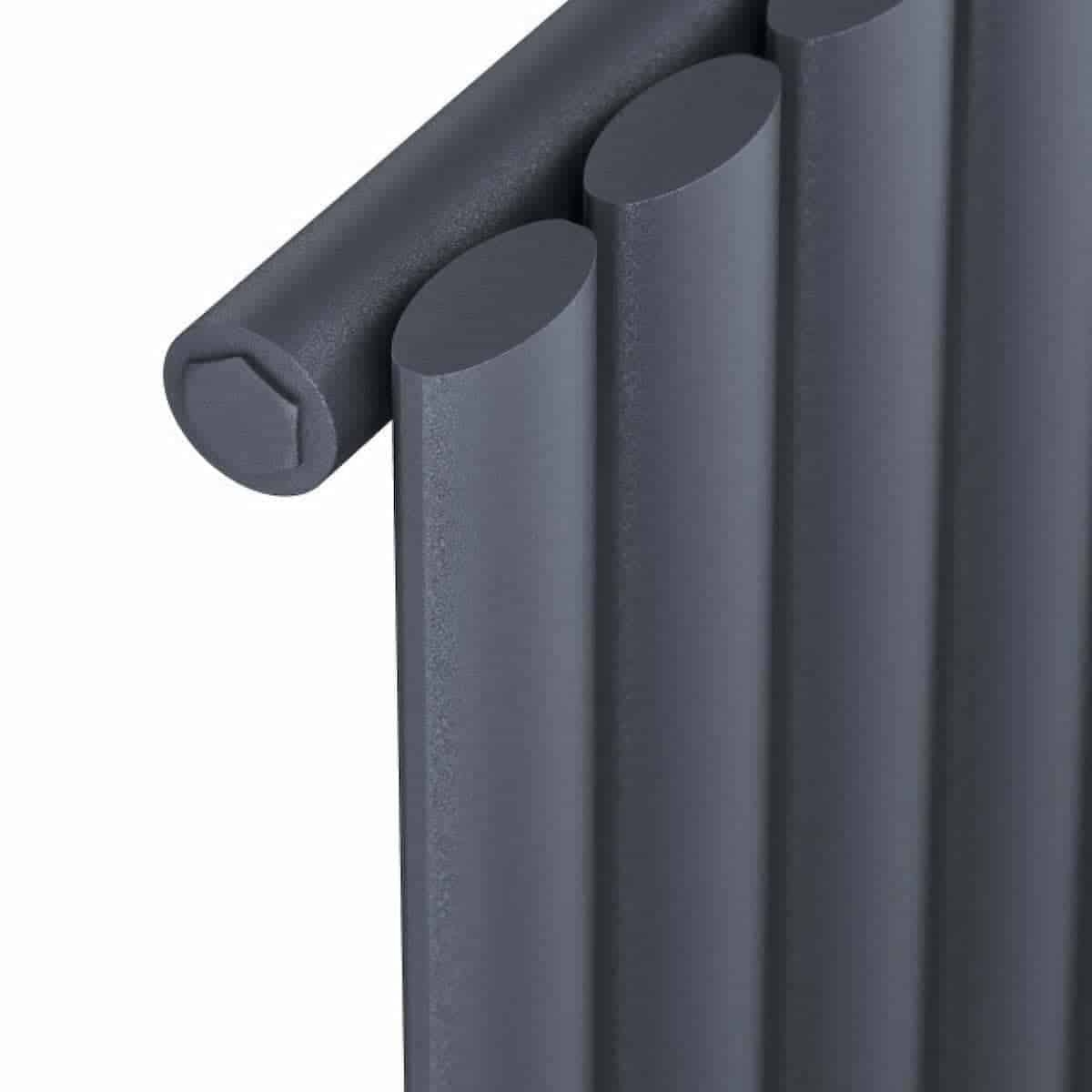 Sleek dark grey radiator with modern cylindrical panels and a matching valve, ideal for contemporary bathrooms and heating solutions.