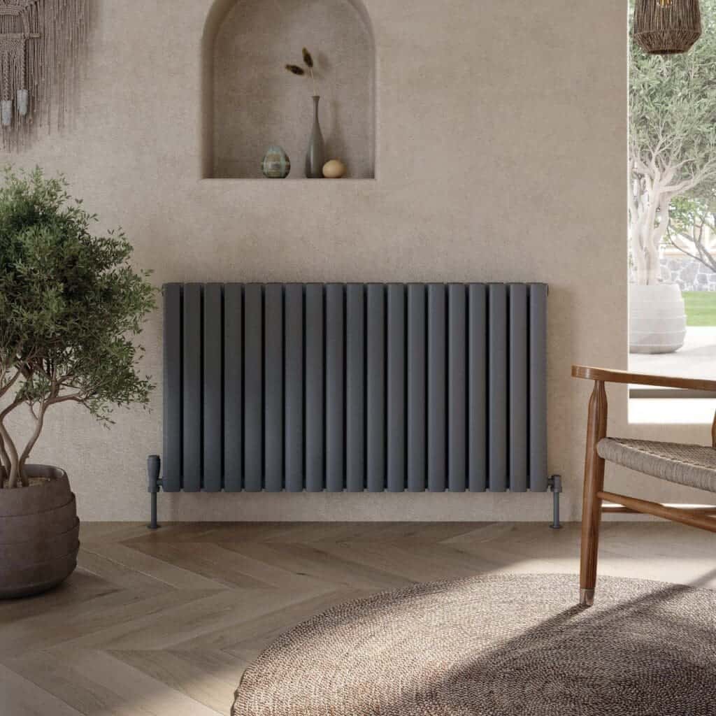 Modern grey radiator in a stylish contemporary bathroom with natural décor and soft lighting, creating a warm and inviting space.