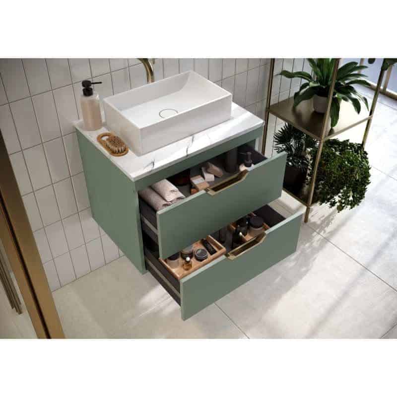 Sleek modern bathroom vanity with green drawers and white countertop basin, surrounded by stylish bathroom accessories and lush indoor plants. Perfect for contemporary bathroom designs.