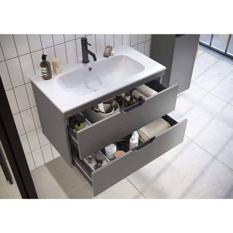 Neatly organised bathroom vanity with open drawers containing toiletries and towels, modern grey cabinetry, white ceramic sink with black faucet, minimalist bathroom design, tiled wall, natural lighting from large window, stylish and functional bathroom storage solution, Bubly Bathrooms.