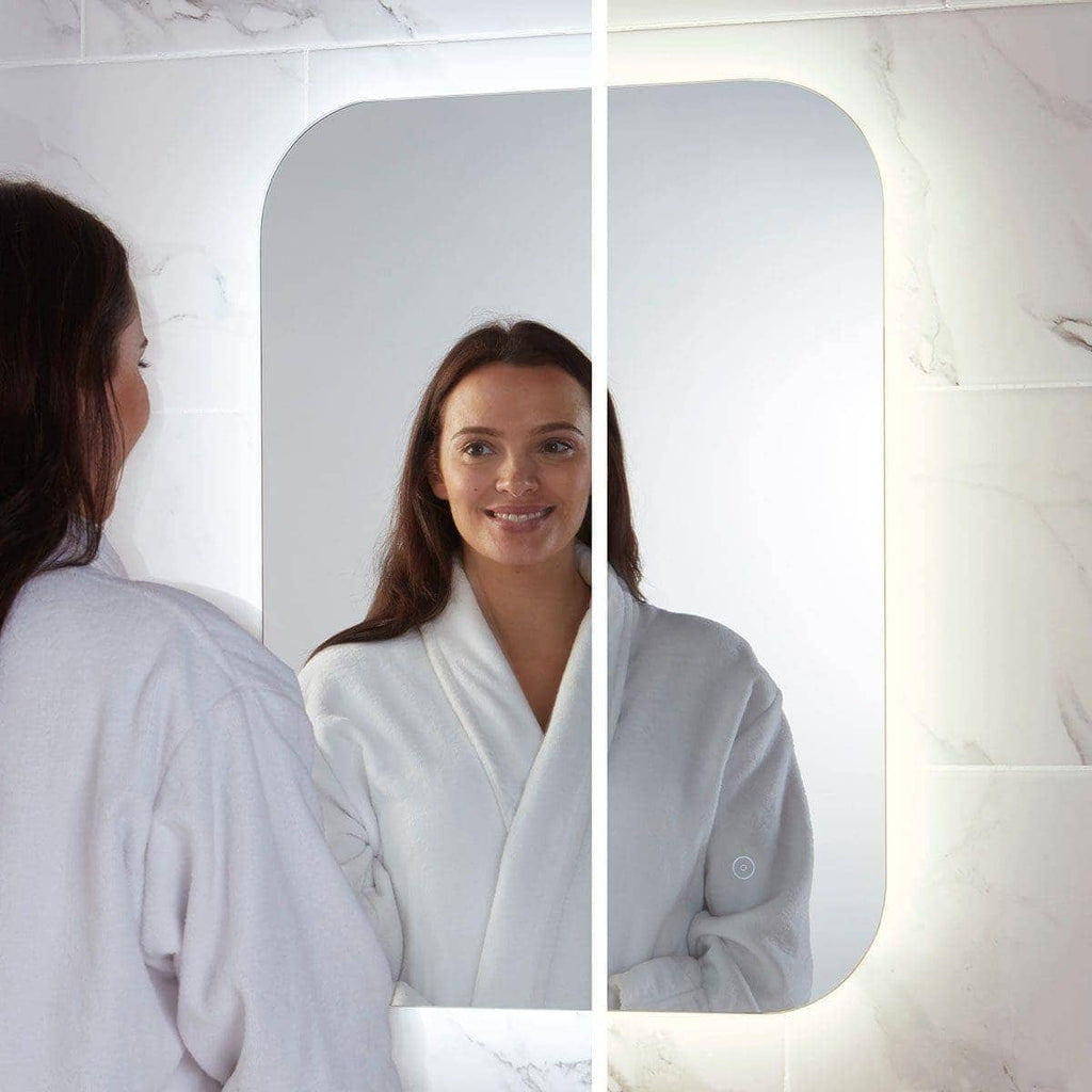 Shiny illuminated modern bathroom mirror with touch sensor, perfect for contemporary bubbles bathrooms, providing bright, clear reflection for daily grooming routines.