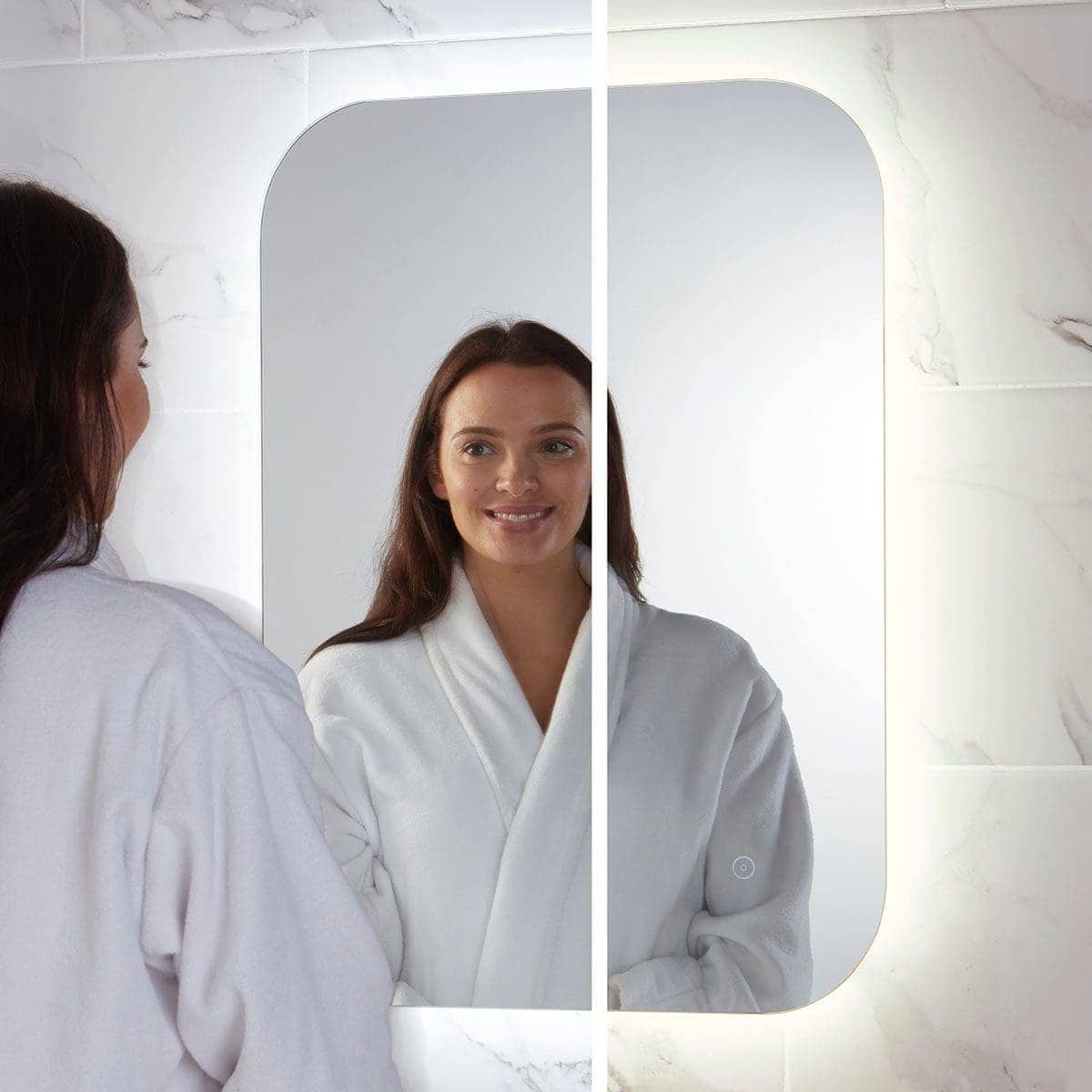 Shiny illuminated modern bathroom mirror with touch sensor, perfect for contemporary bubbles bathrooms, providing bright, clear reflection for daily grooming routines.